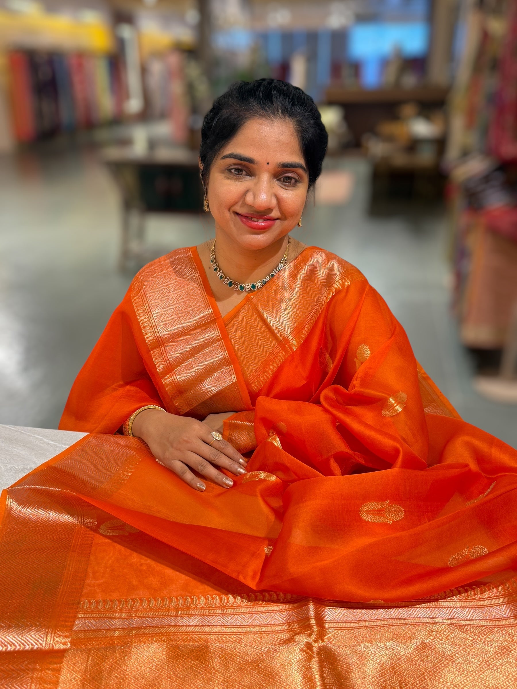 Orange Premium Kora Banarasi Saree with heavy weaving borders and Raw mango style motifs