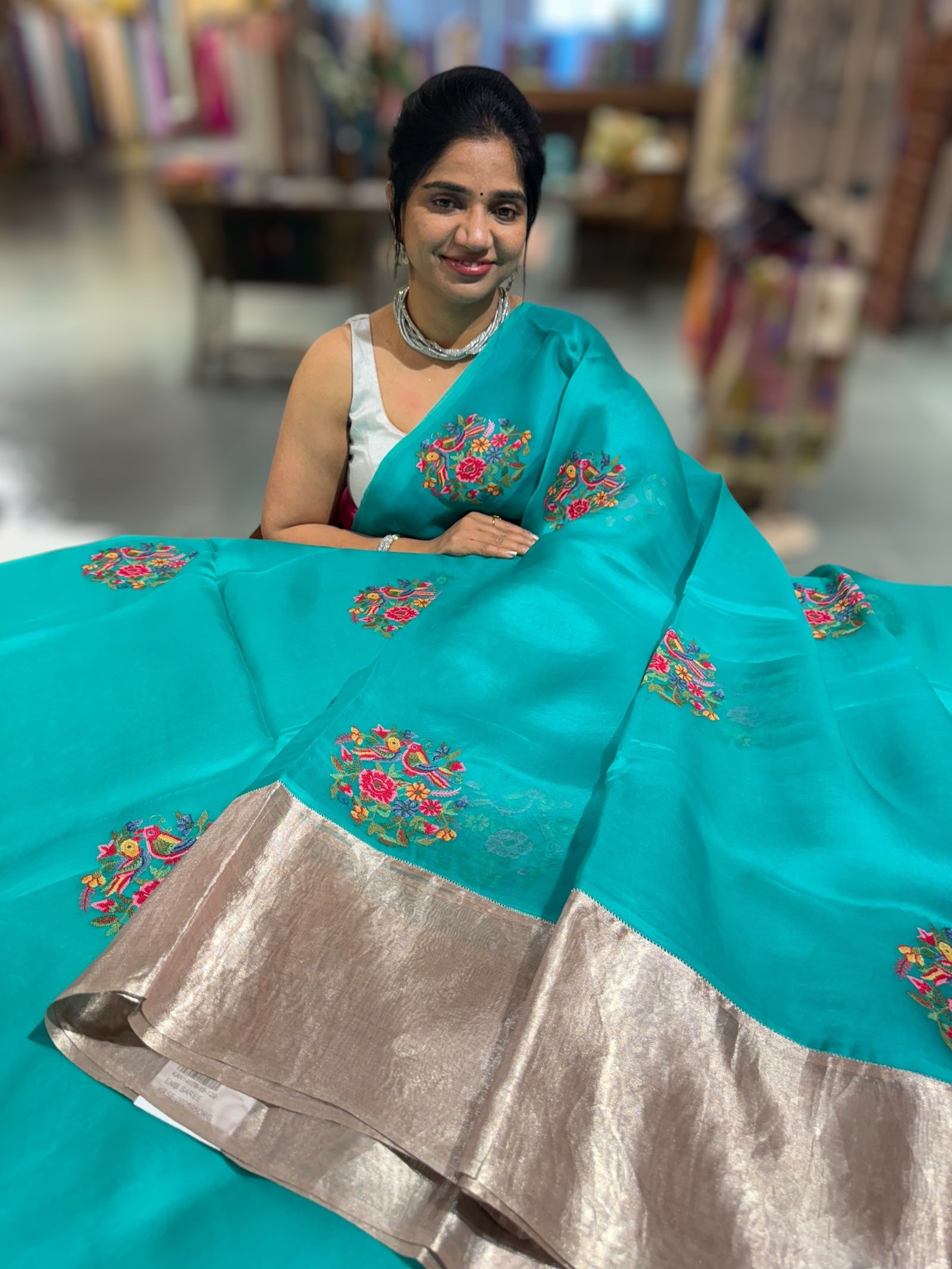Teal Organza Saree with pure Tissue Border