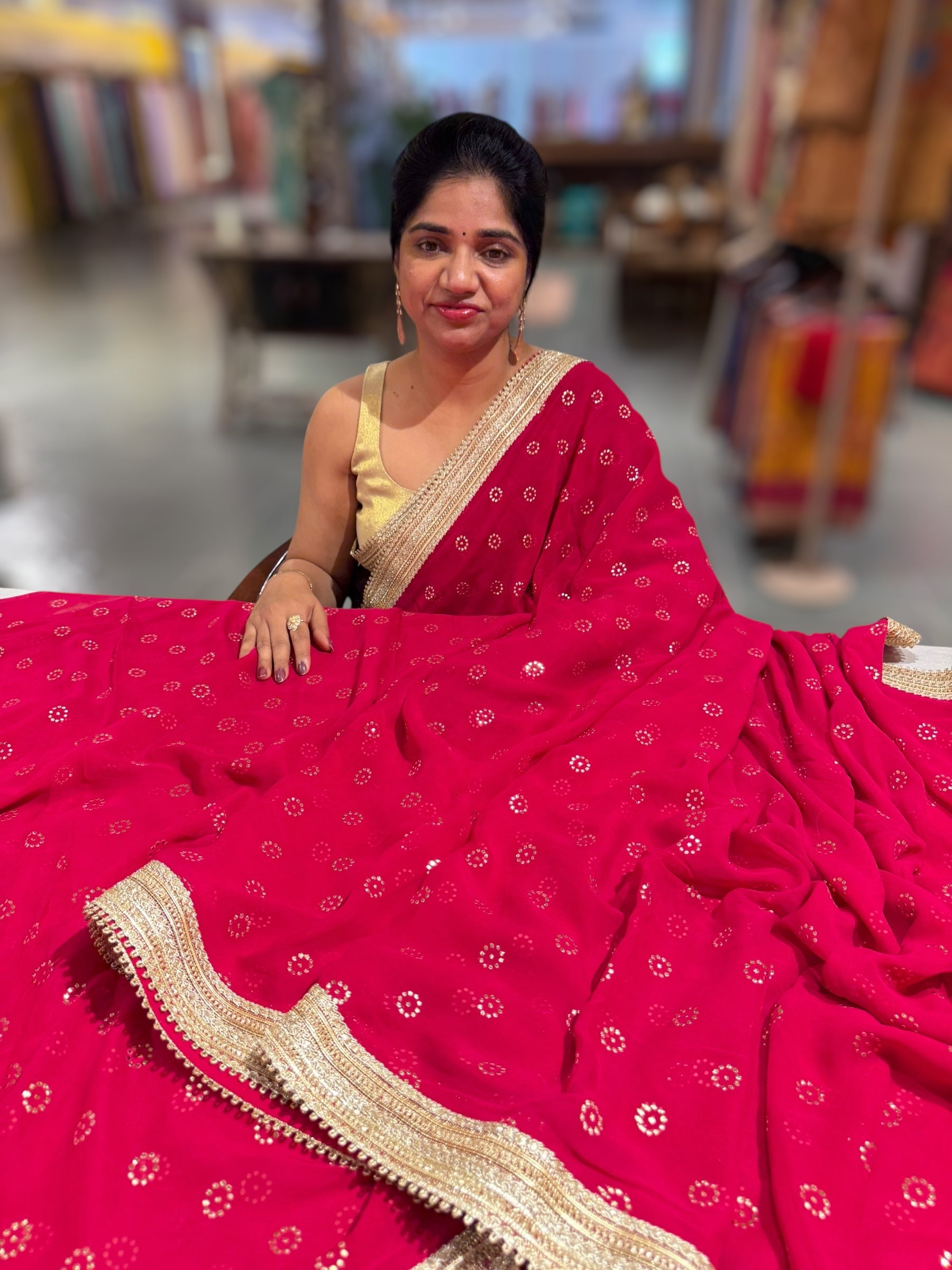 Dark Pink Georgette Saree with stick on Badla in flower pattern