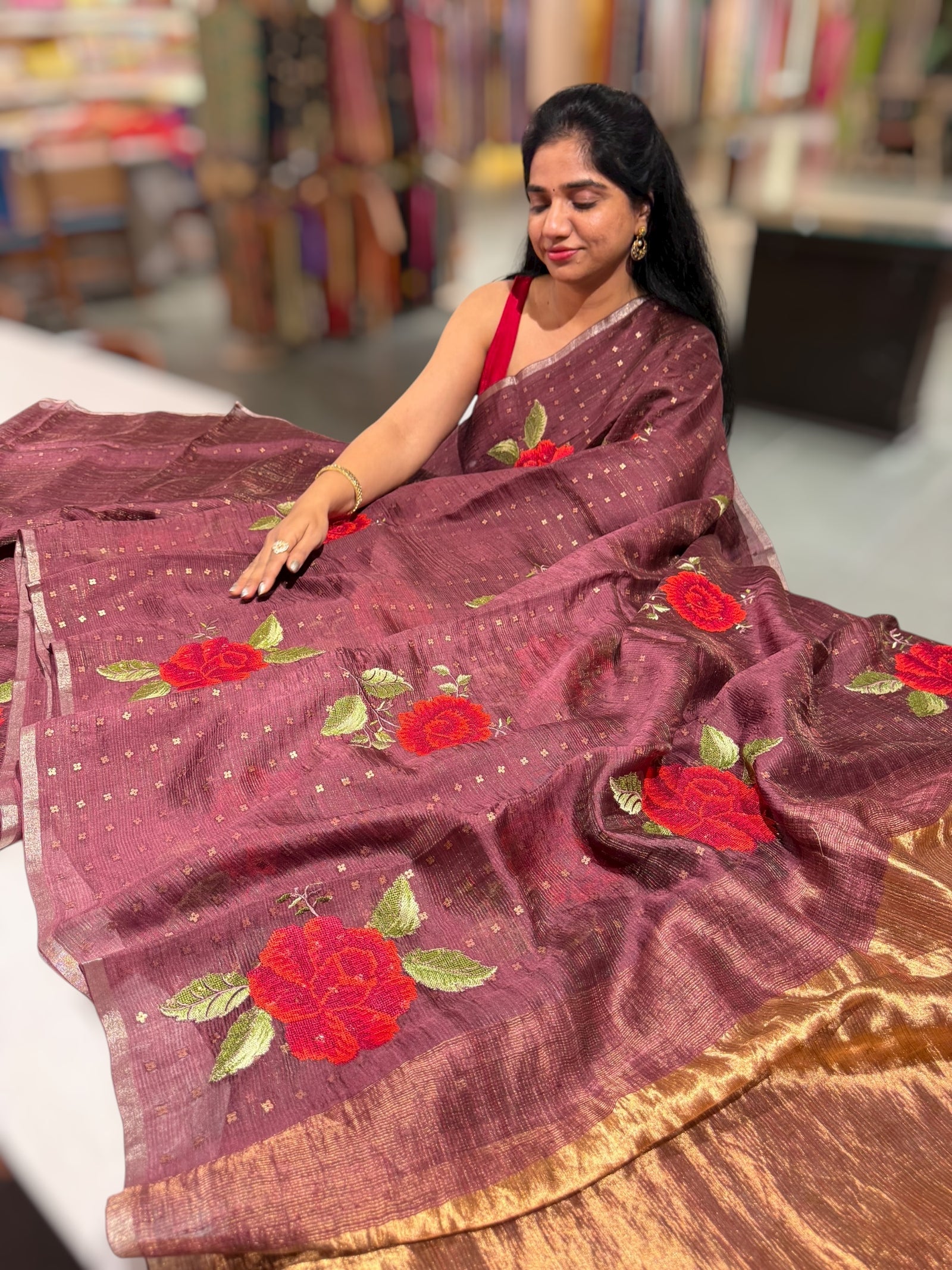 Winish brown Tussar Kota Saree with embedded sequnce and hibuscus flower embroidery