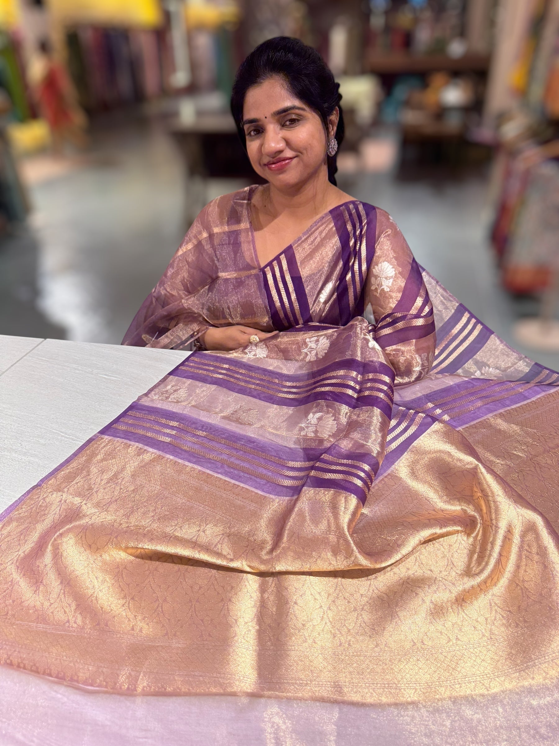 Purple Banarasi Handloom Kora Tissue Stripes with allover kaduwa woven lotus  motifs .