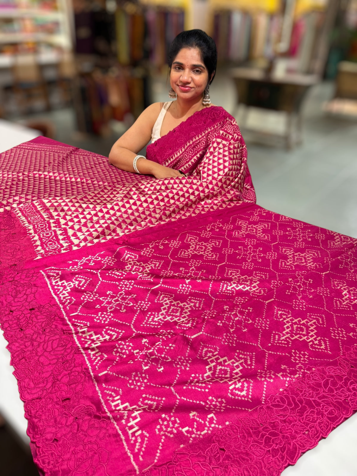 Ruby pink Cambodian–inspired Ikkat Silk Saree with cutwork Rose Border