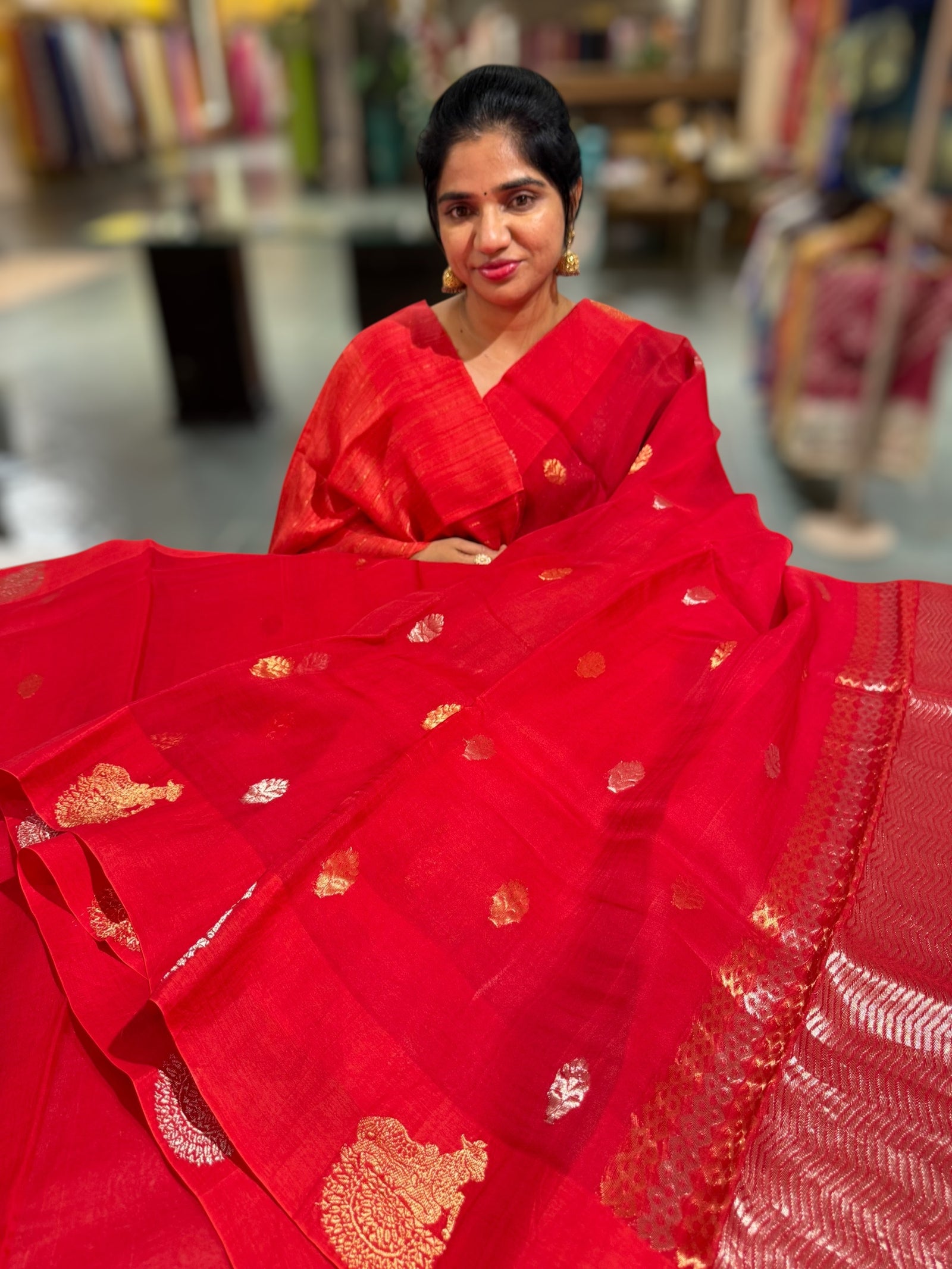 Red kora muslin sarees with kaduwa woven nandi motif border