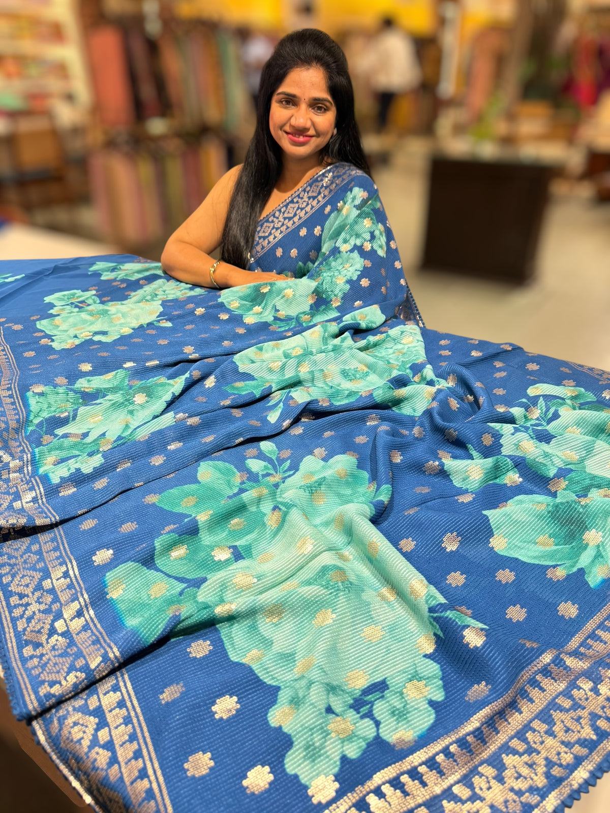 Blue georgette sequence saree with statement floral print