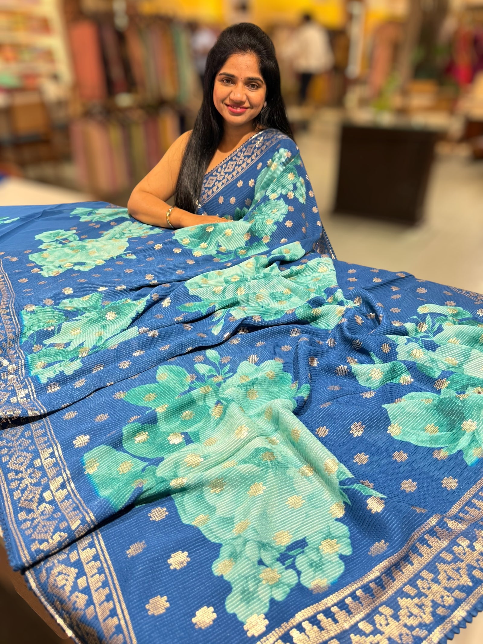 Blue georgette sequence saree with statement floral print