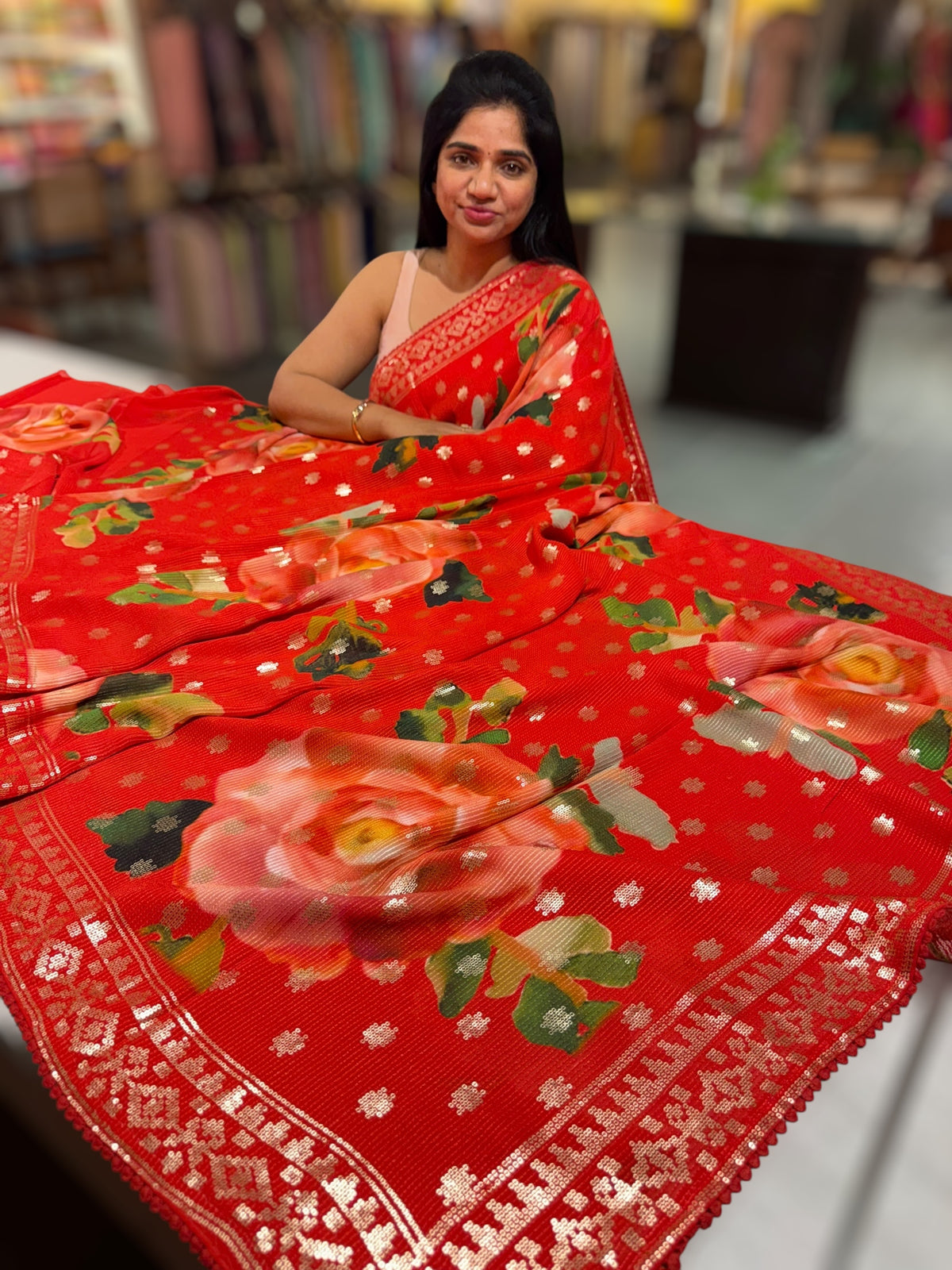 Red georgette sequence saree with statement floral print