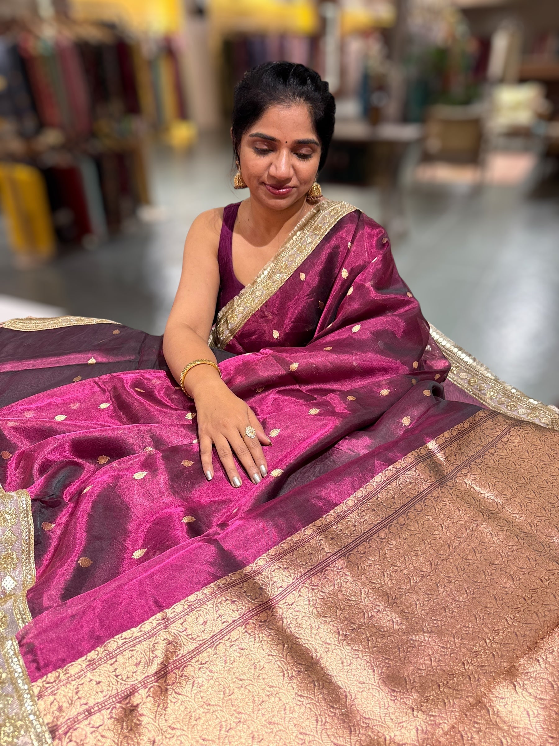 Wine Pure handloom Banarasi Tissue saree hemlined with Sabhyasachi style fringe laces .