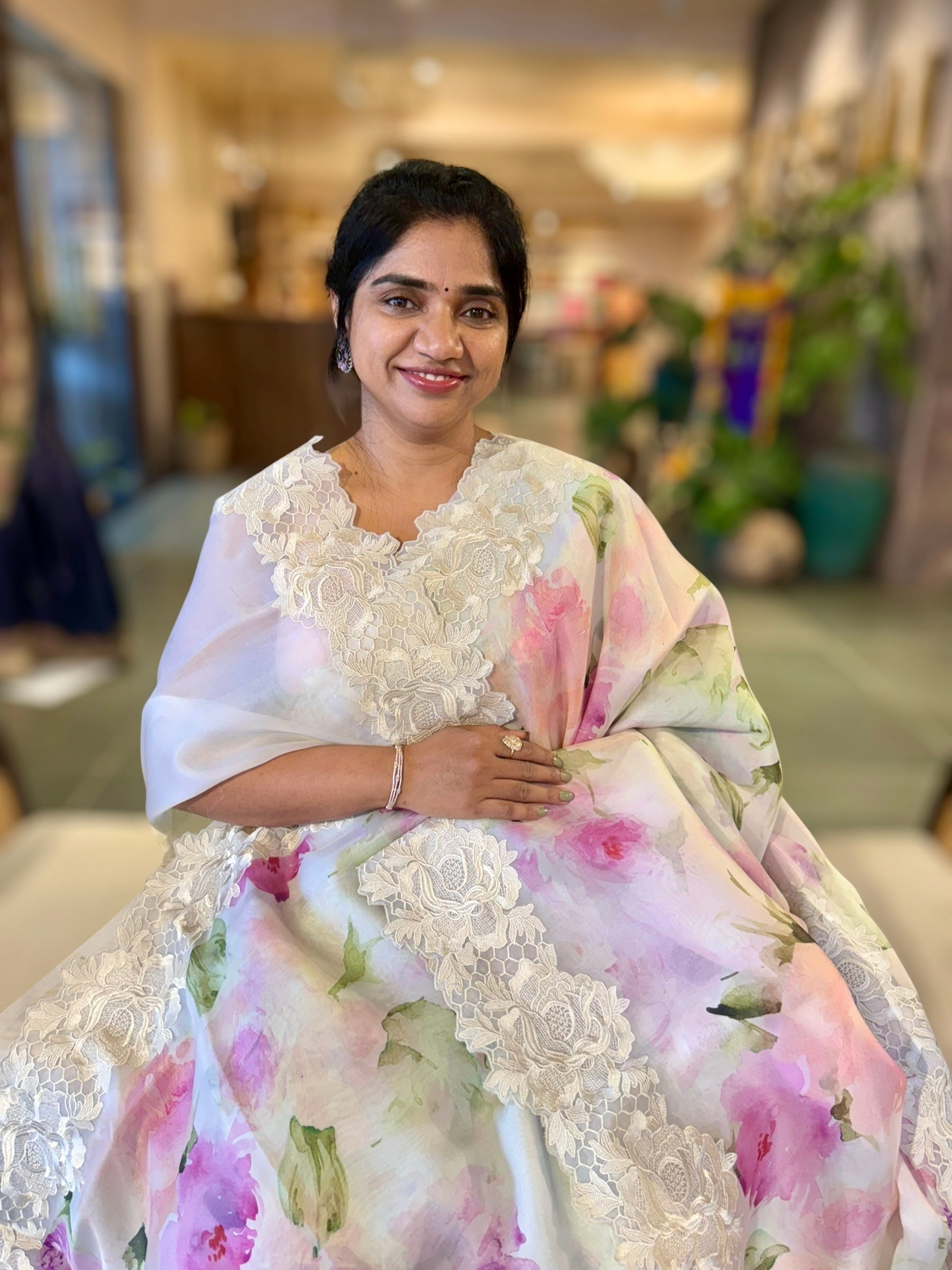Ivory Printed Organza Saree With Chantilly Lace Style Embroidered Border.