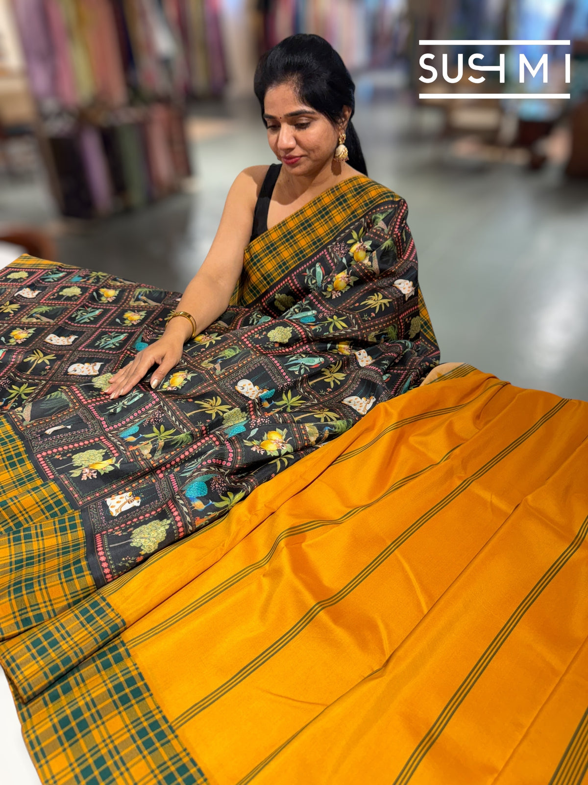 Black printed soft silk saree with burberry checks border : D62F033