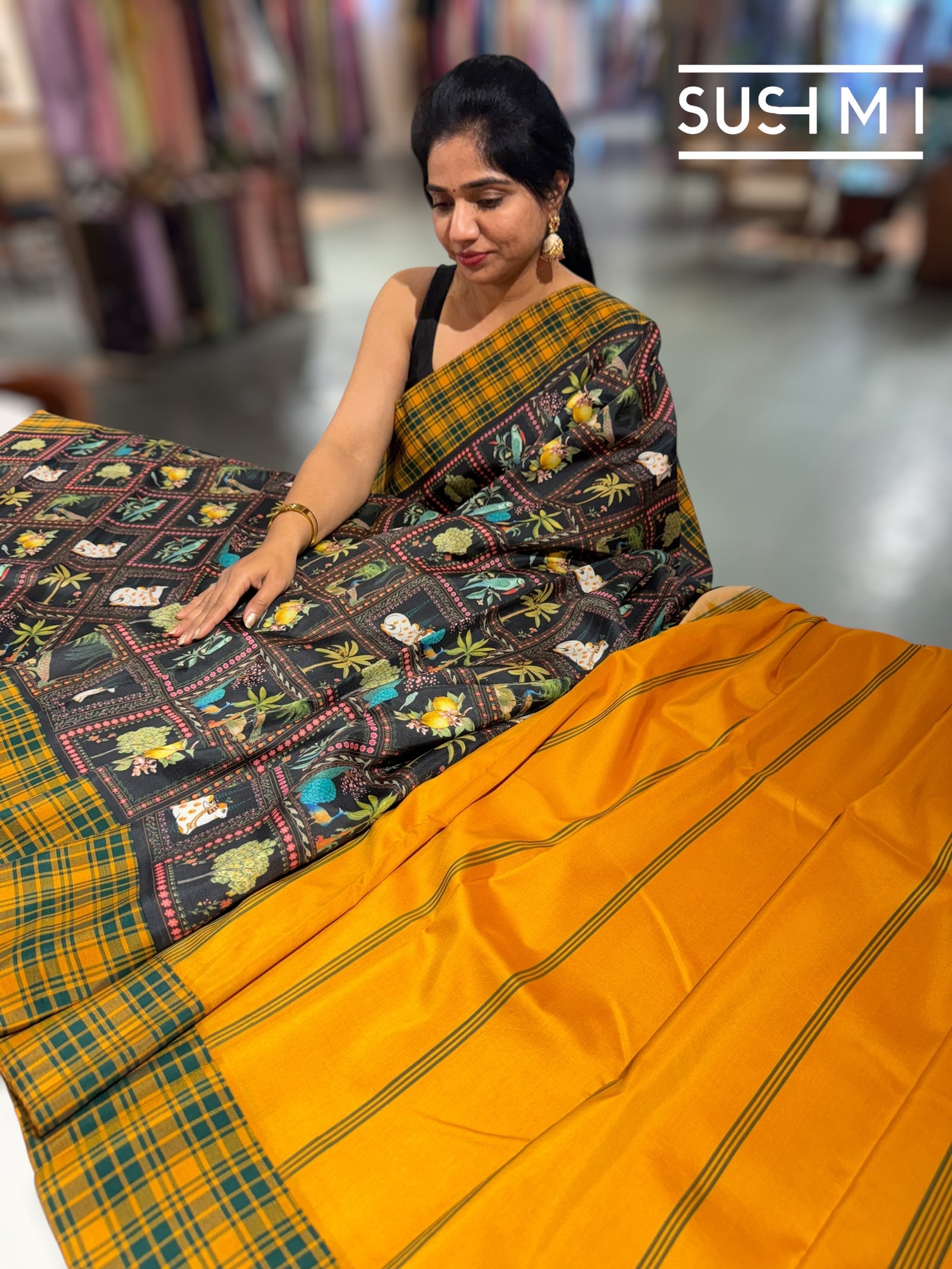 Black printed soft silk saree with burberry checks border : D62F033