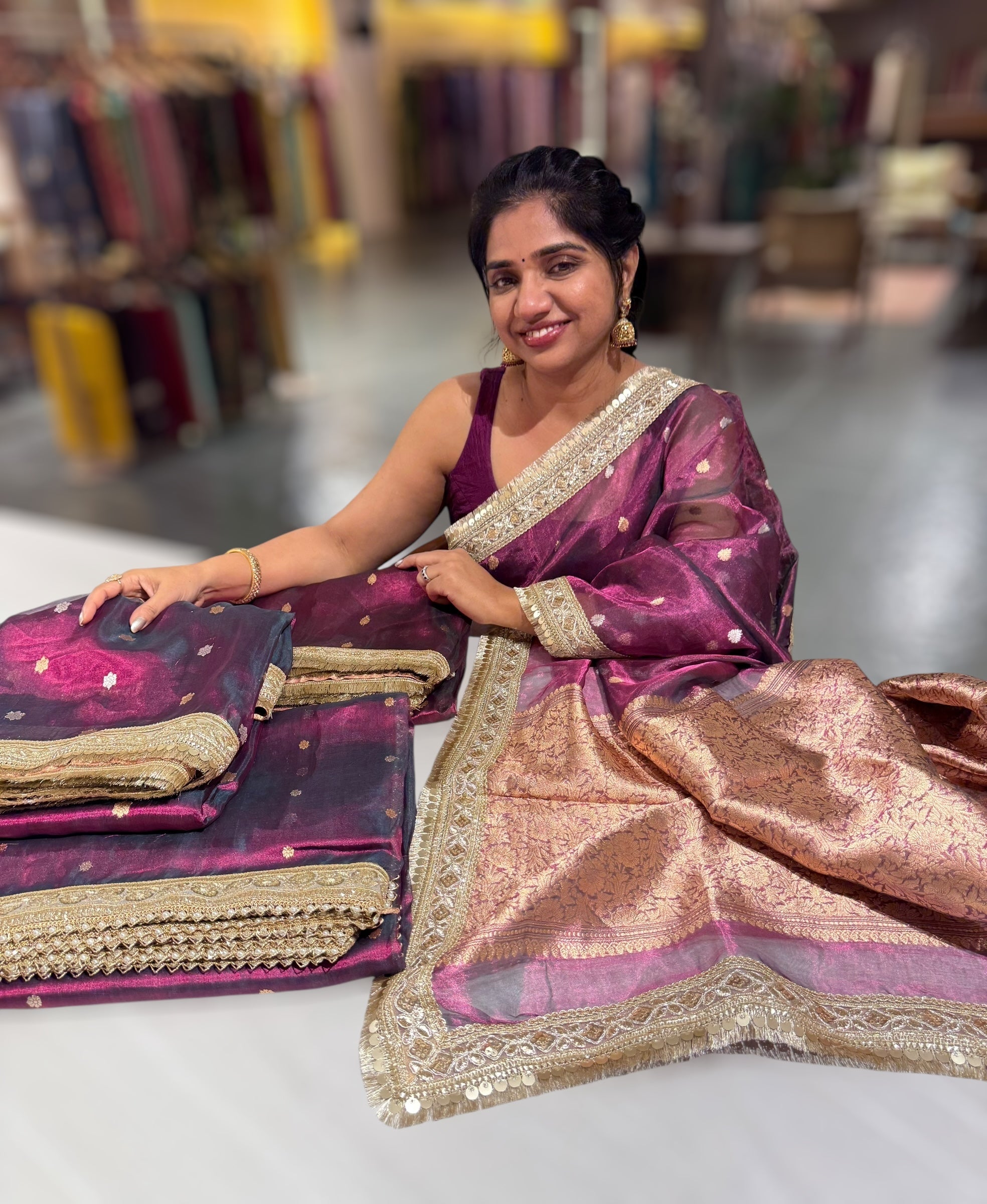 Wine Pure handloom Banarasi Tissue saree hemlined with Sabhyasachi style fringe laces .