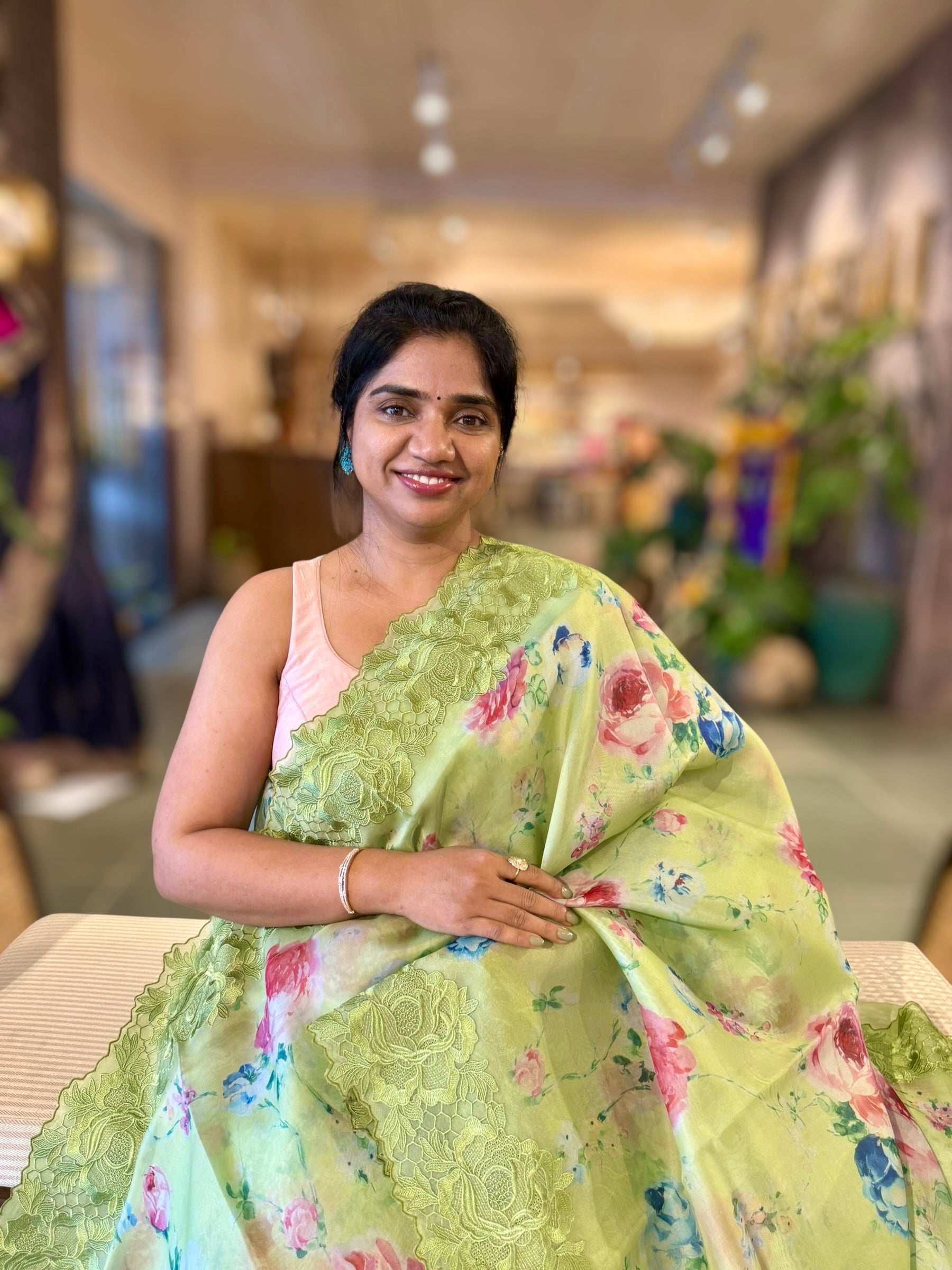 Parrot Green Printed Organza Saree With Chantilly Lace Style Embroidered Border.