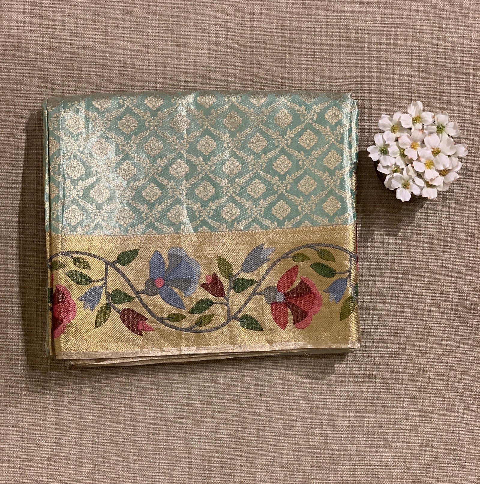 Sea Green Kanchi Tissue Brocade Saree With jamdani inspired embroidery.