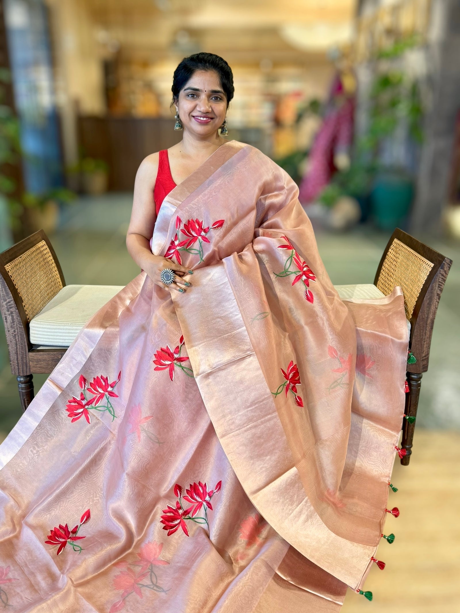 Onion Pink Organza Saree with Lotus flower embroidery and Satin Borders.