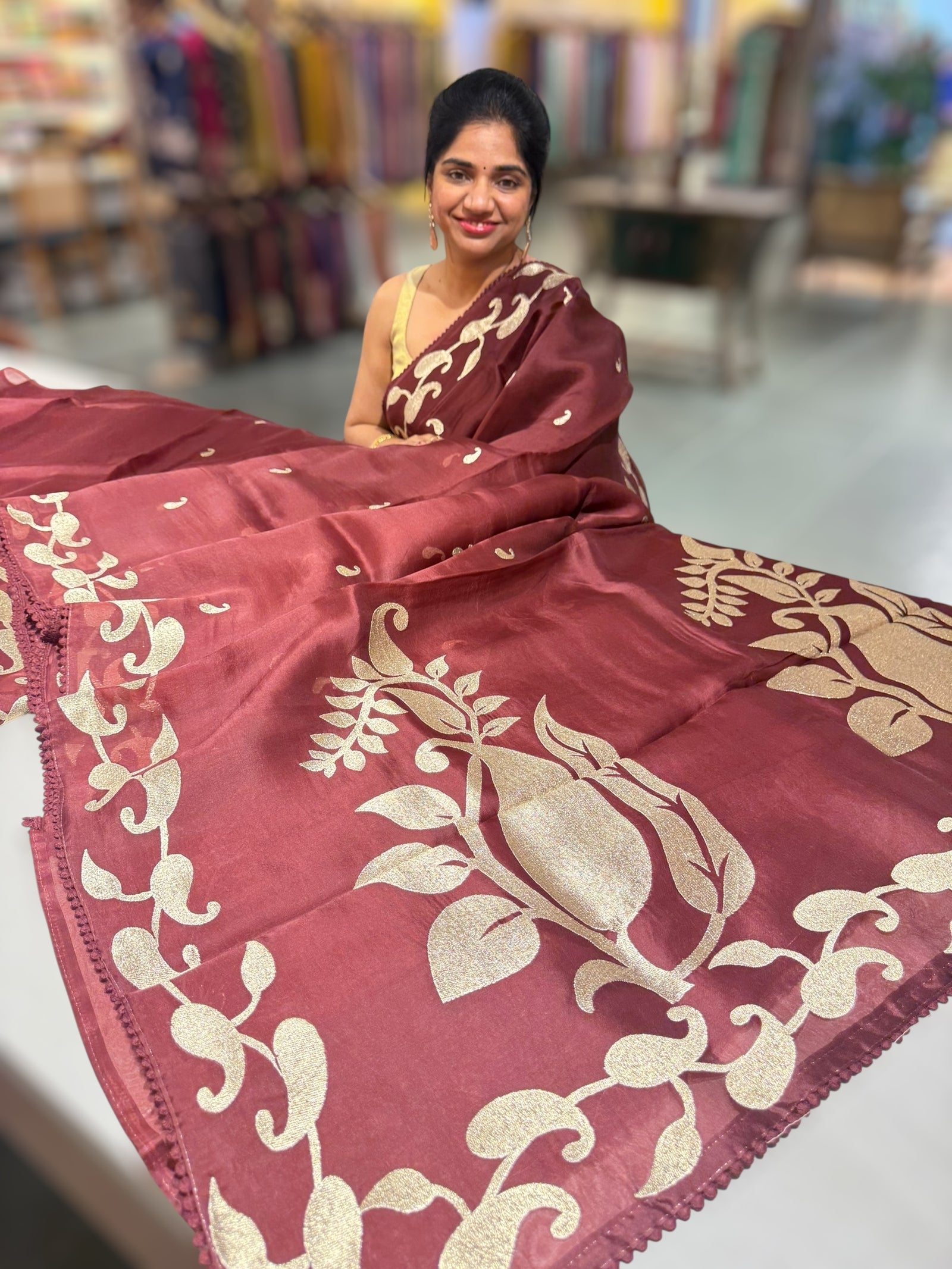 Meroonish Brown Organza Saree with stunning zari embroidered mango border and heavy designer pallu