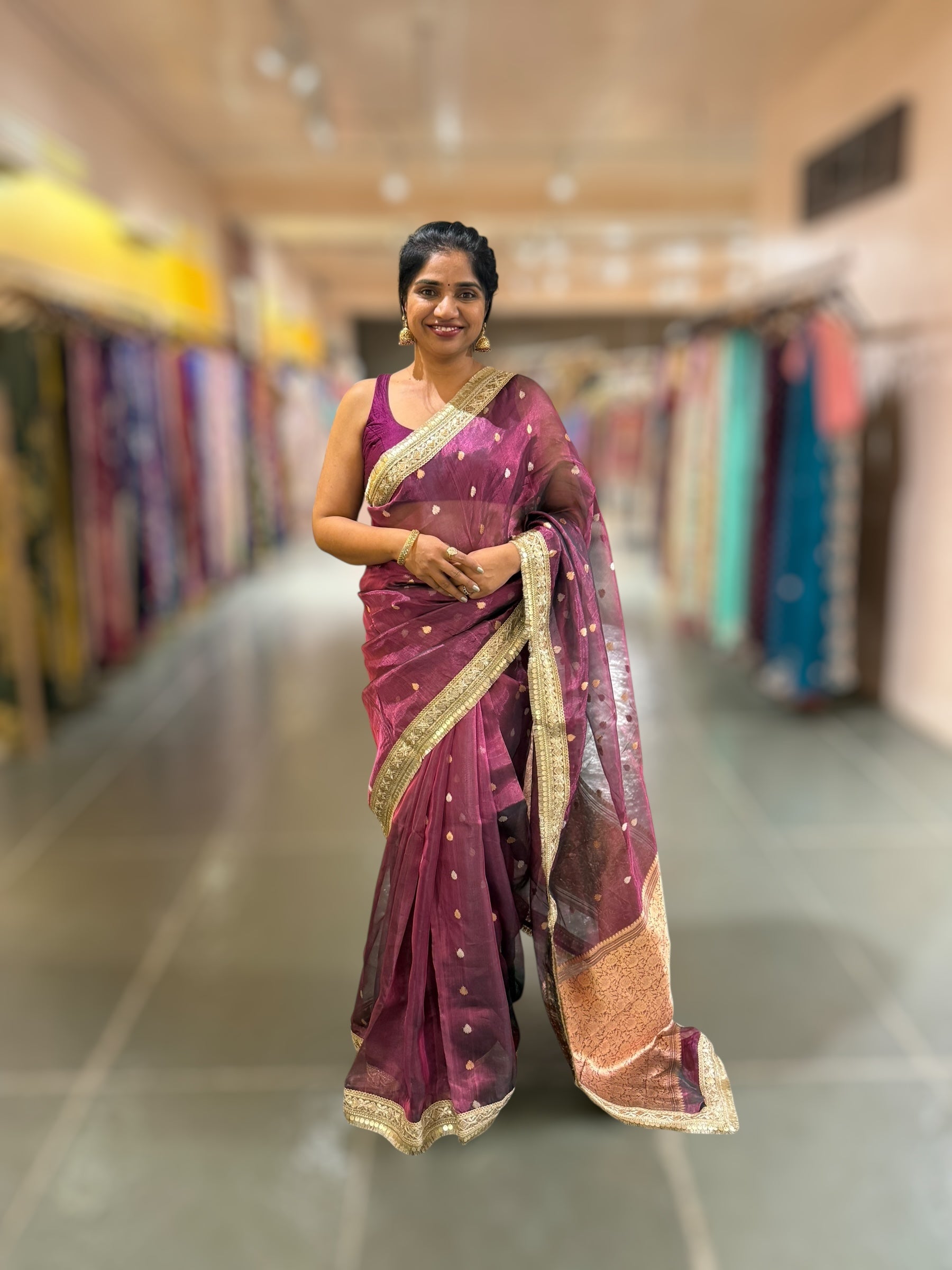 Wine Pure handloom Banarasi Tissue saree hemlined with Sabhyasachi style fringe laces .