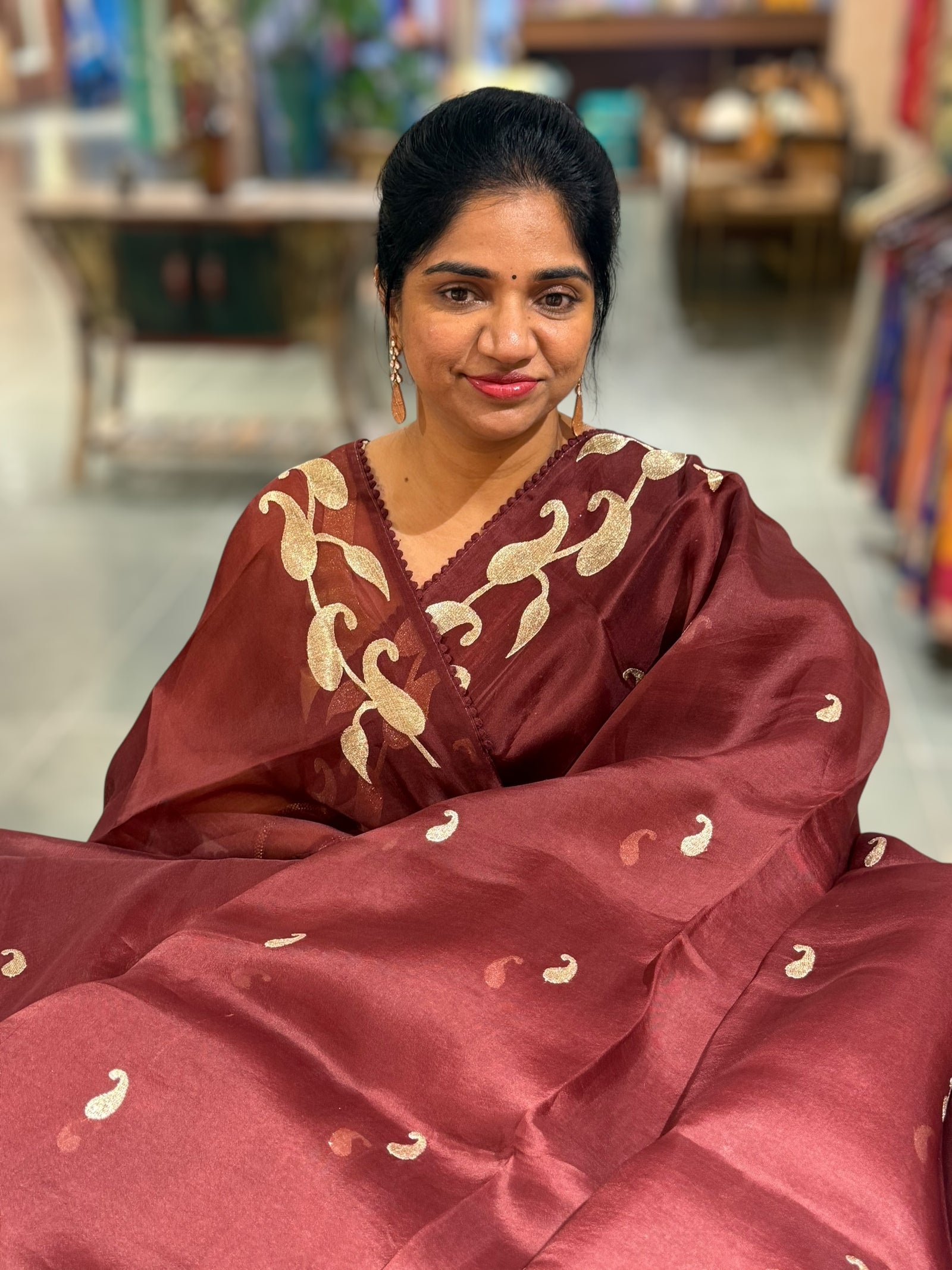 Meroonish Brown Organza Saree with stunning zari embroidered mango border and heavy designer pallu