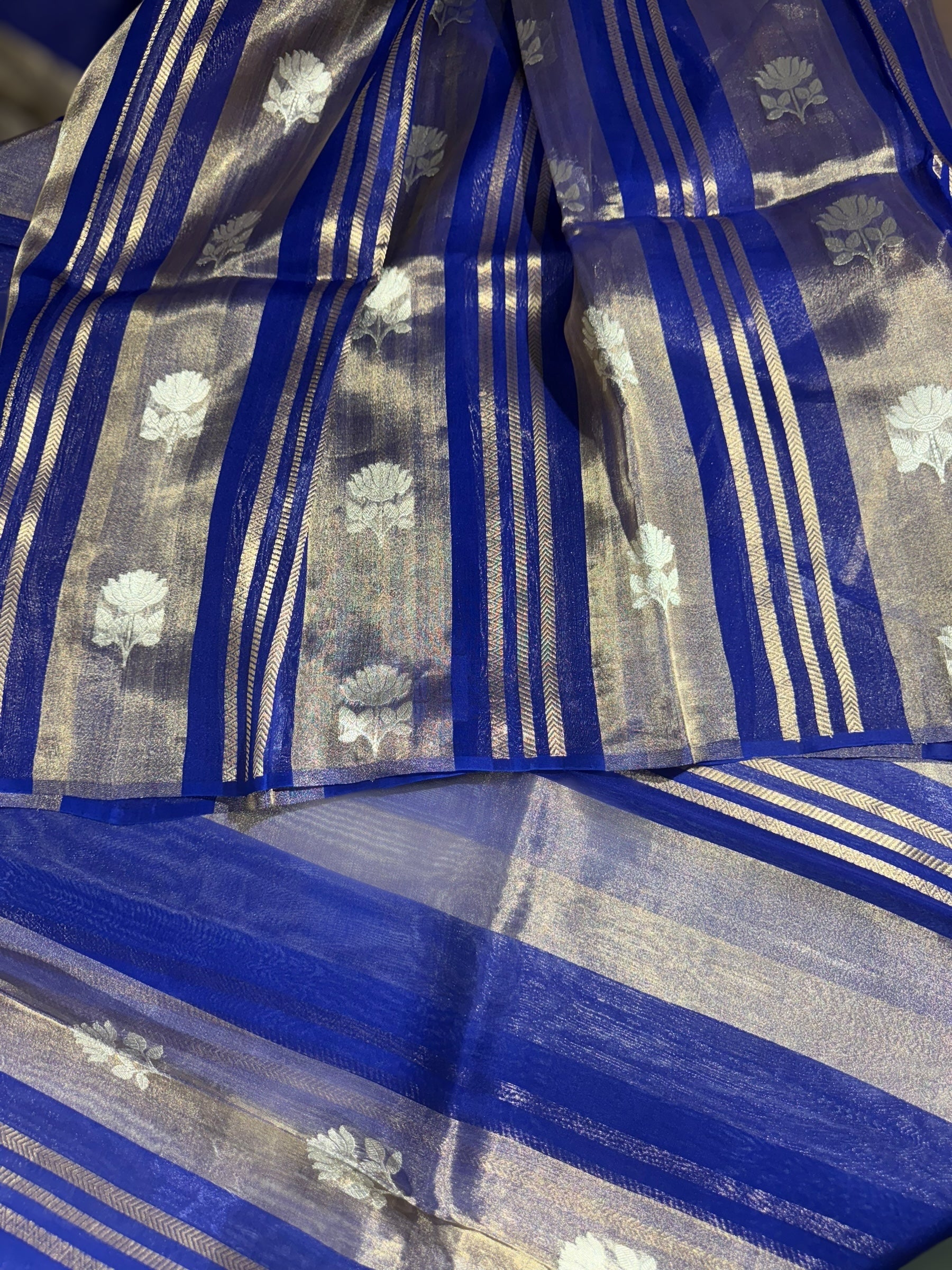 Royal Blue Banarasi Handloom Kora Tissue Stripes with allover kaduwa woven lotus  motifs .