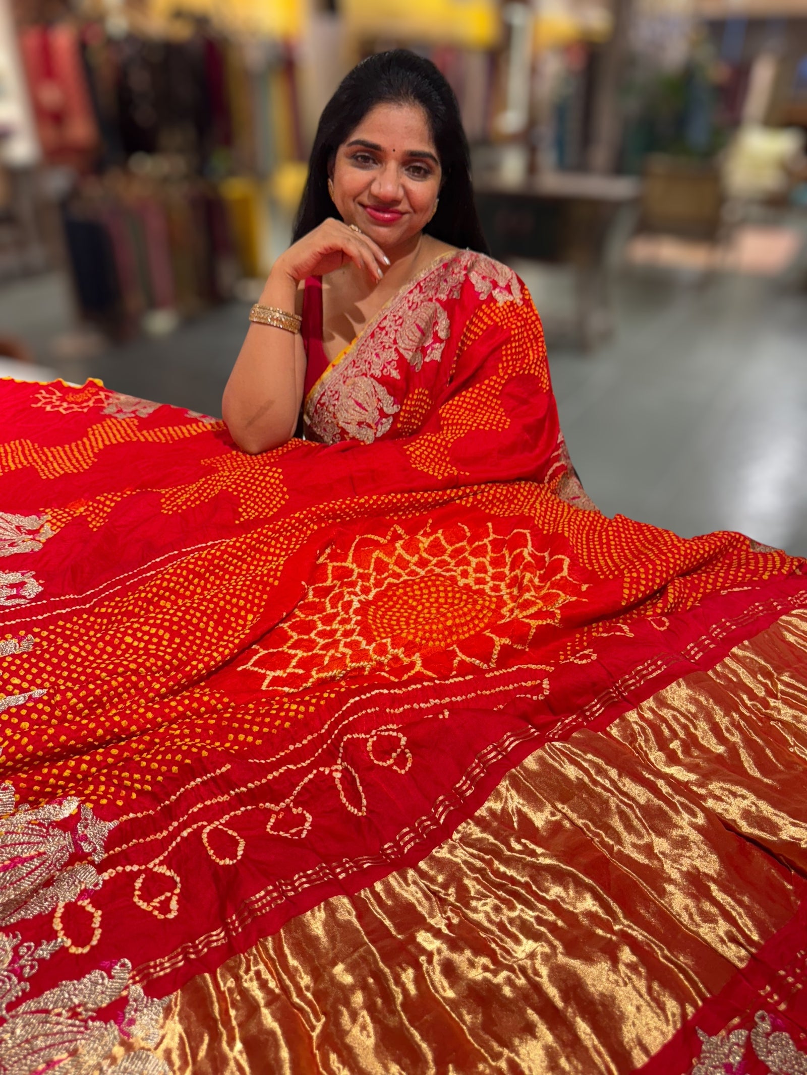 Reddish Orange Designer Rai Bandhej Saree With Embroidered Border