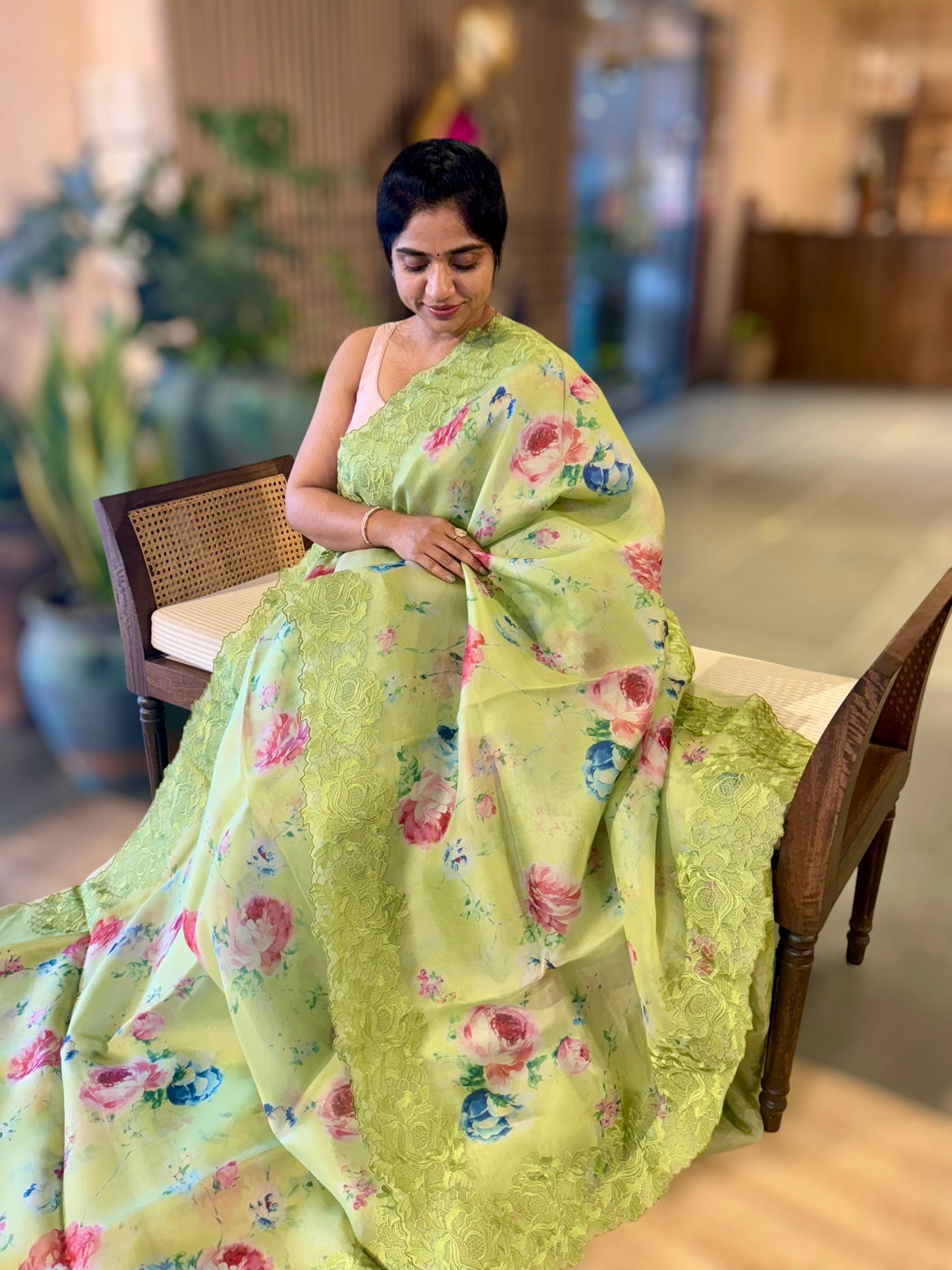 Parrot Green Printed Organza Saree With Chantilly Lace Style Embroidered Border.