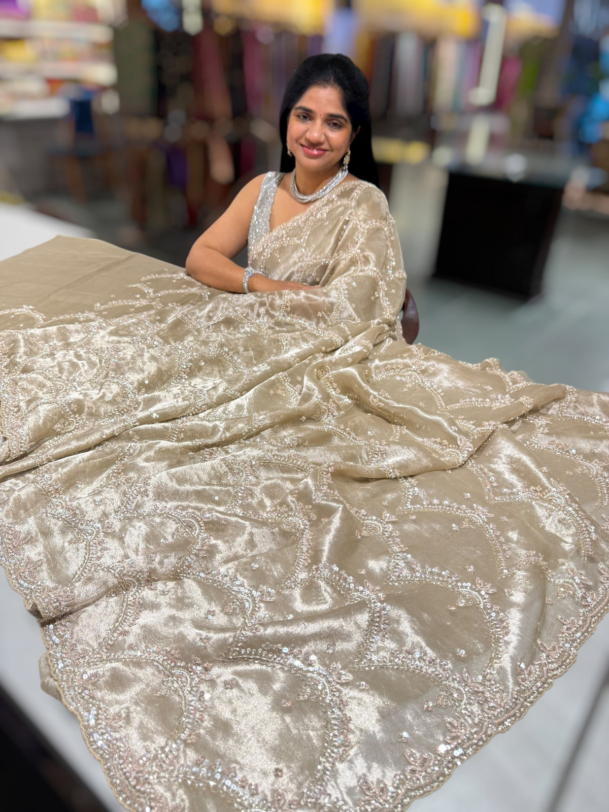 Nude tissue saree with heavy allover intricate handwork