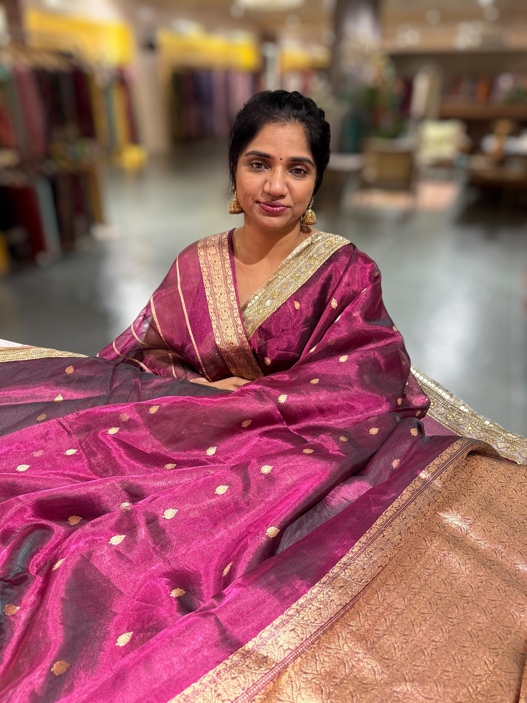 Wine Pure handloom Banarasi Tissue saree hemlined with Sabhyasachi style fringe laces .