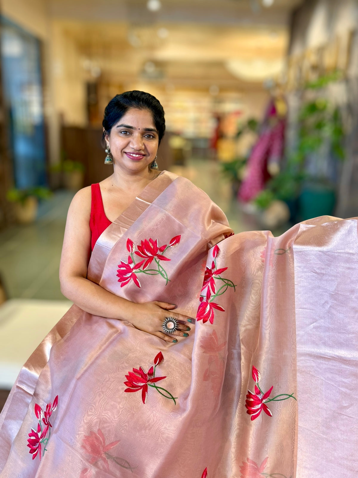 Onion Pink Organza Saree with Lotus flower embroidery and Satin Borders.