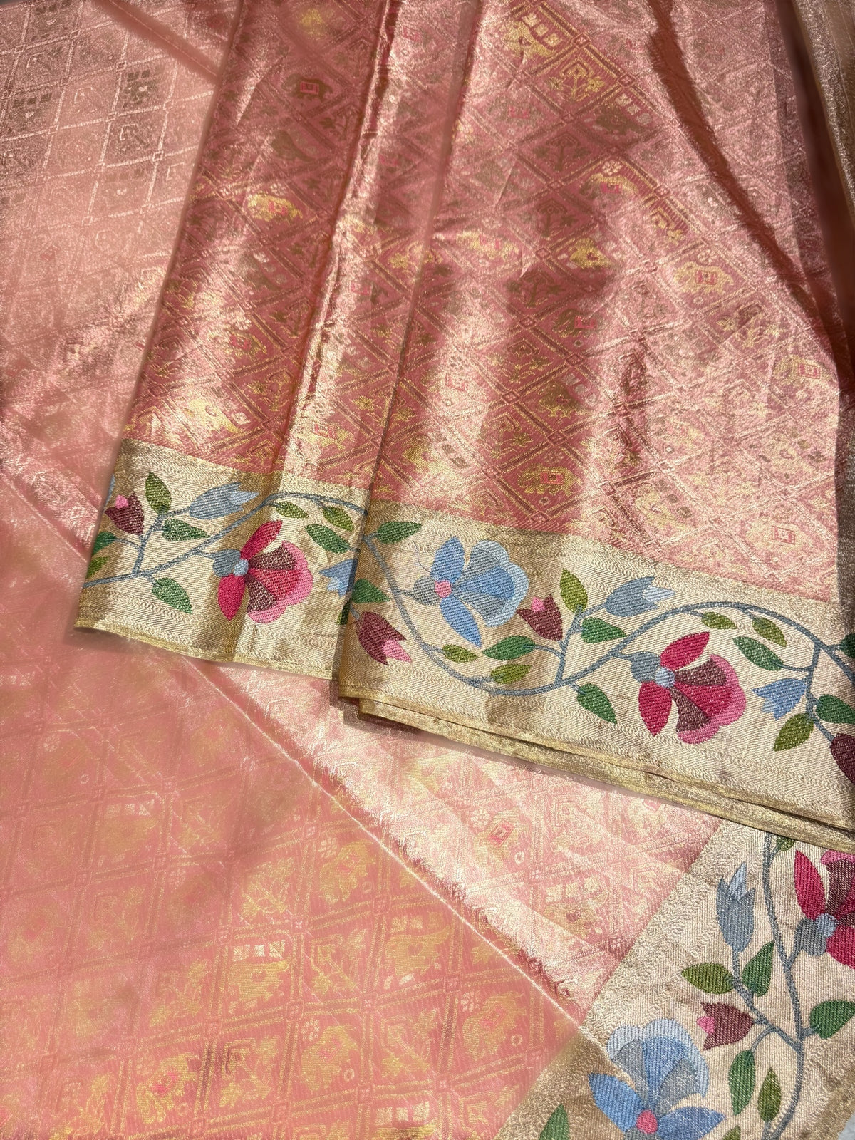 Coral Peach Kanchi Tissue Brocade Saree With jamdani inspired embroidery.
