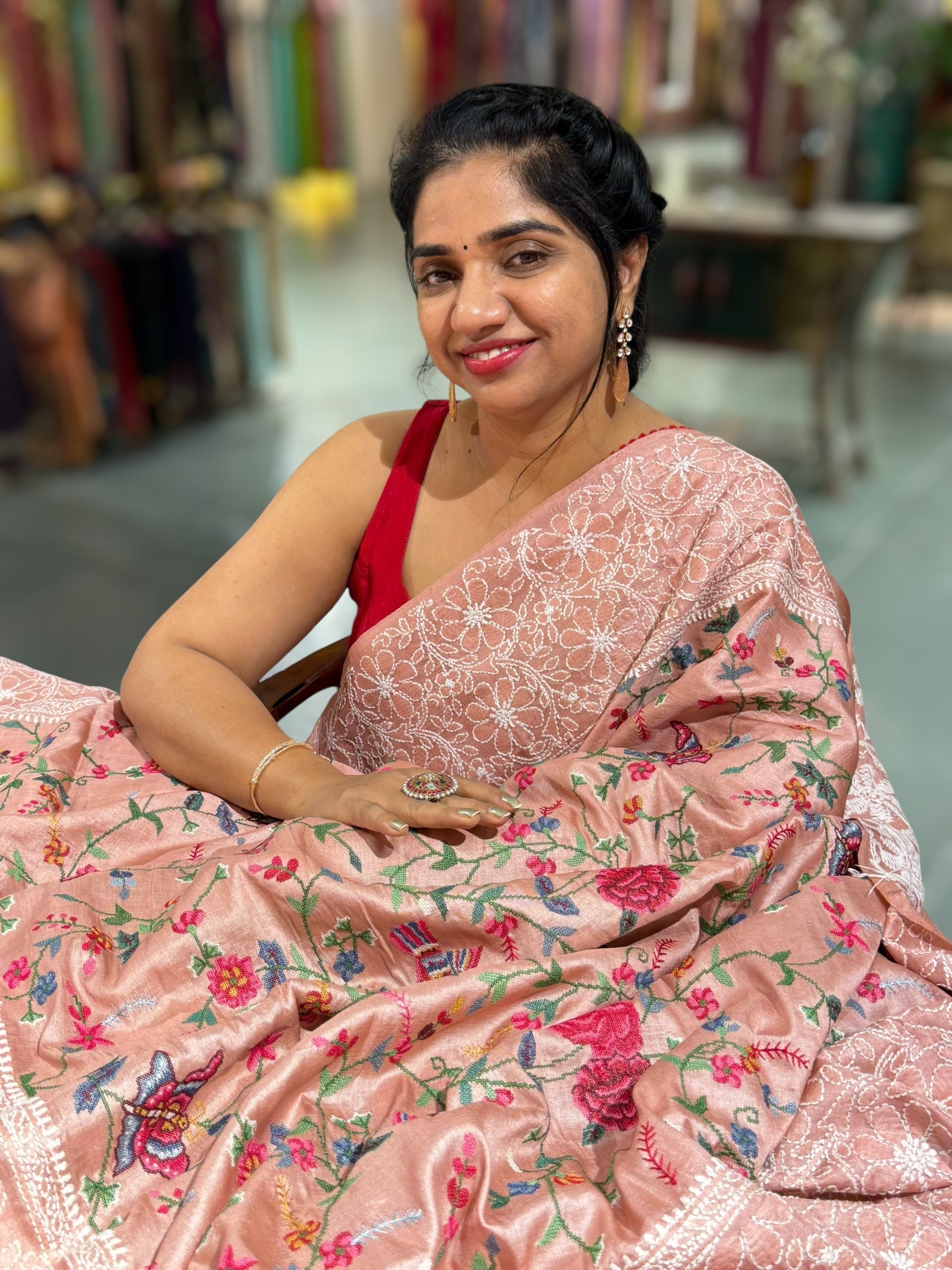 Peach Pink Tussar Saree with lucknowi border and pallu with allover petite point embroidery.