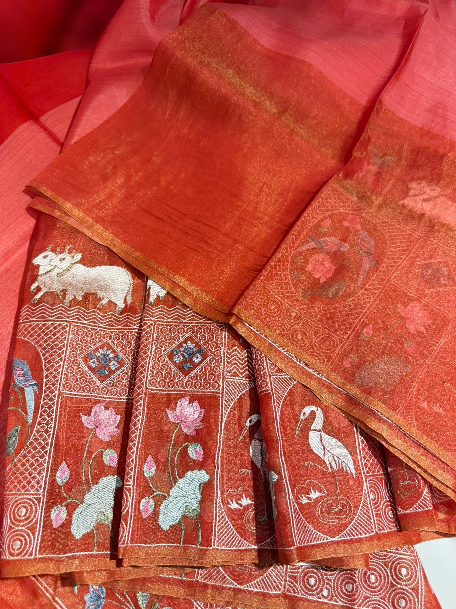 Reddish Orange Kora-Tussar blend Handloom Saree with Tissue embroidered Skirt Border