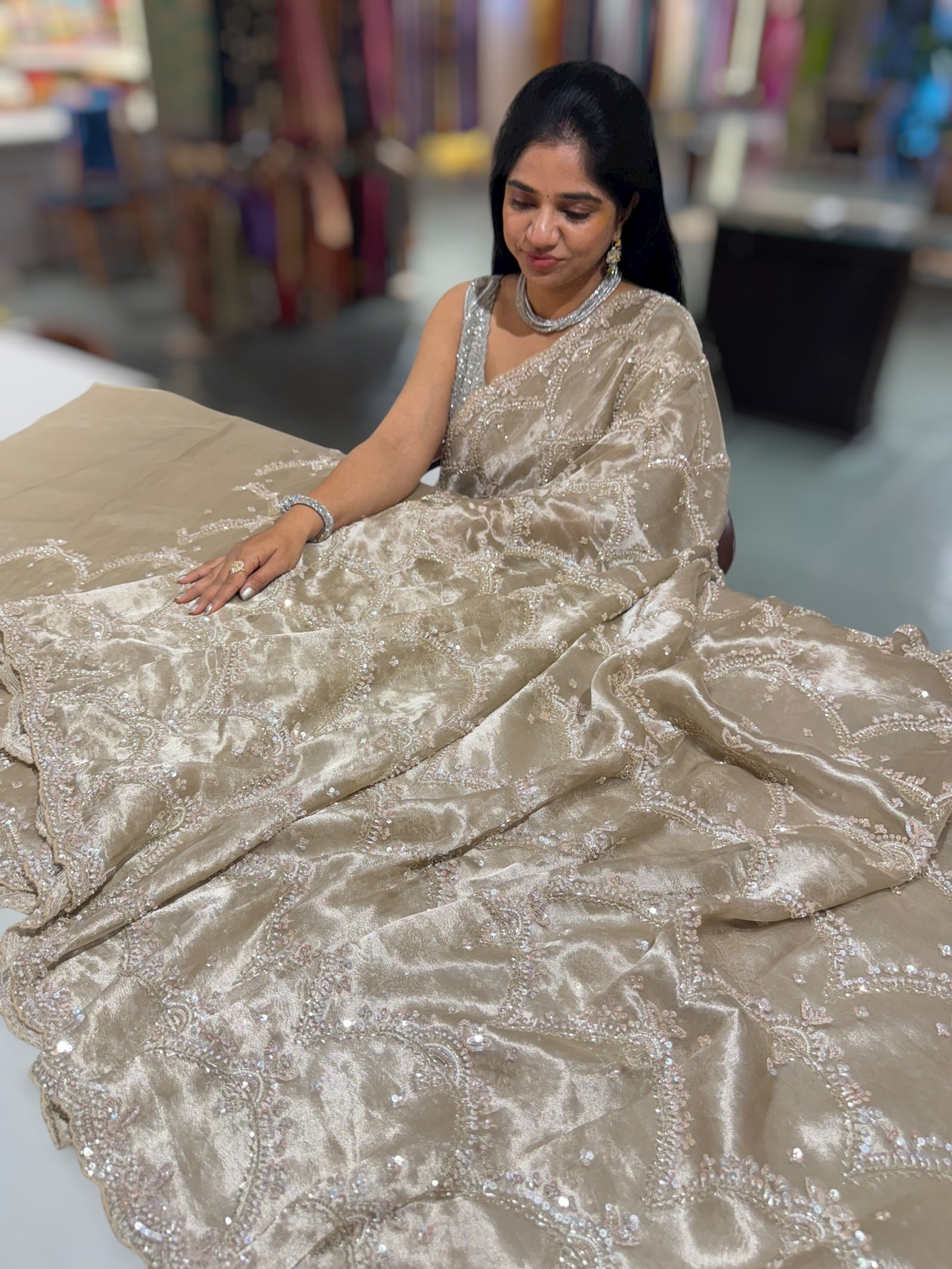 Nude tissue saree with heavy allover intricate handwork