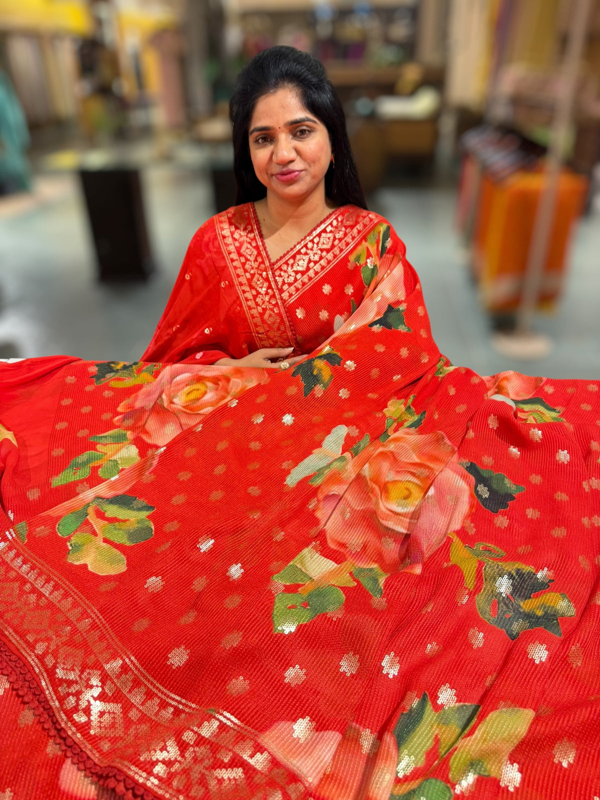Red georgette sequence saree with statement floral print