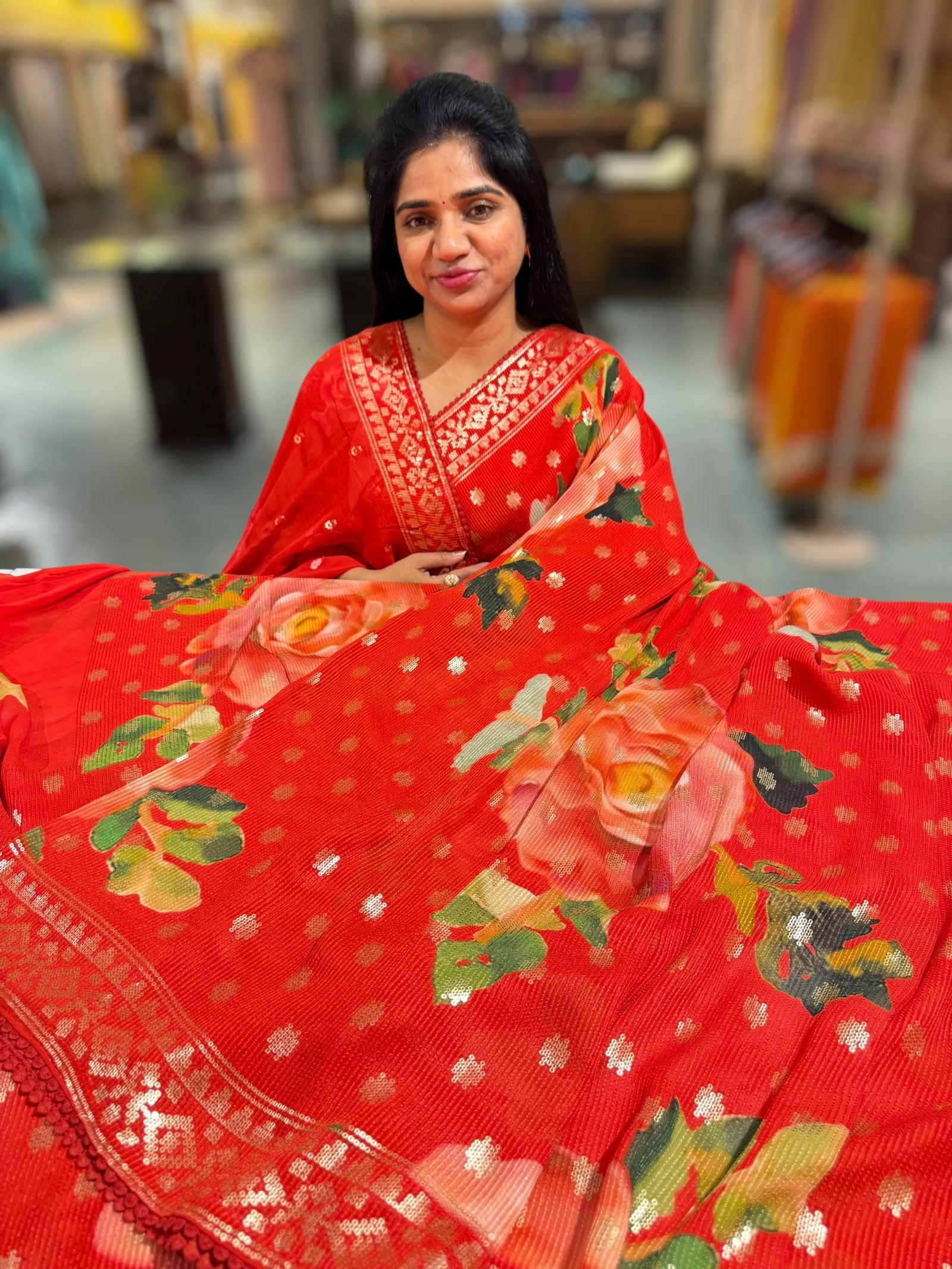 Red georgette sequence saree with statement floral print