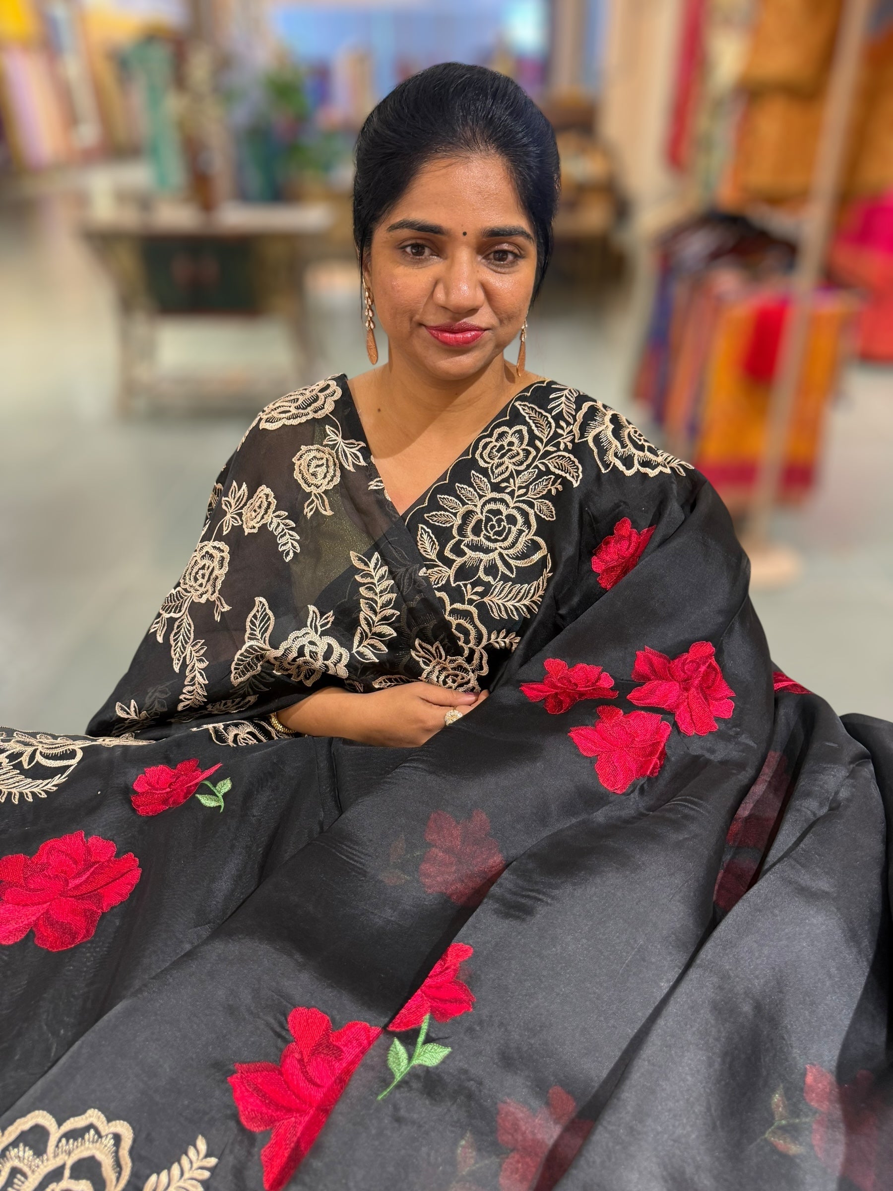 Black Organza Saree with stunning outline floral embroidered cytwork border and red hibuscus flowers allover