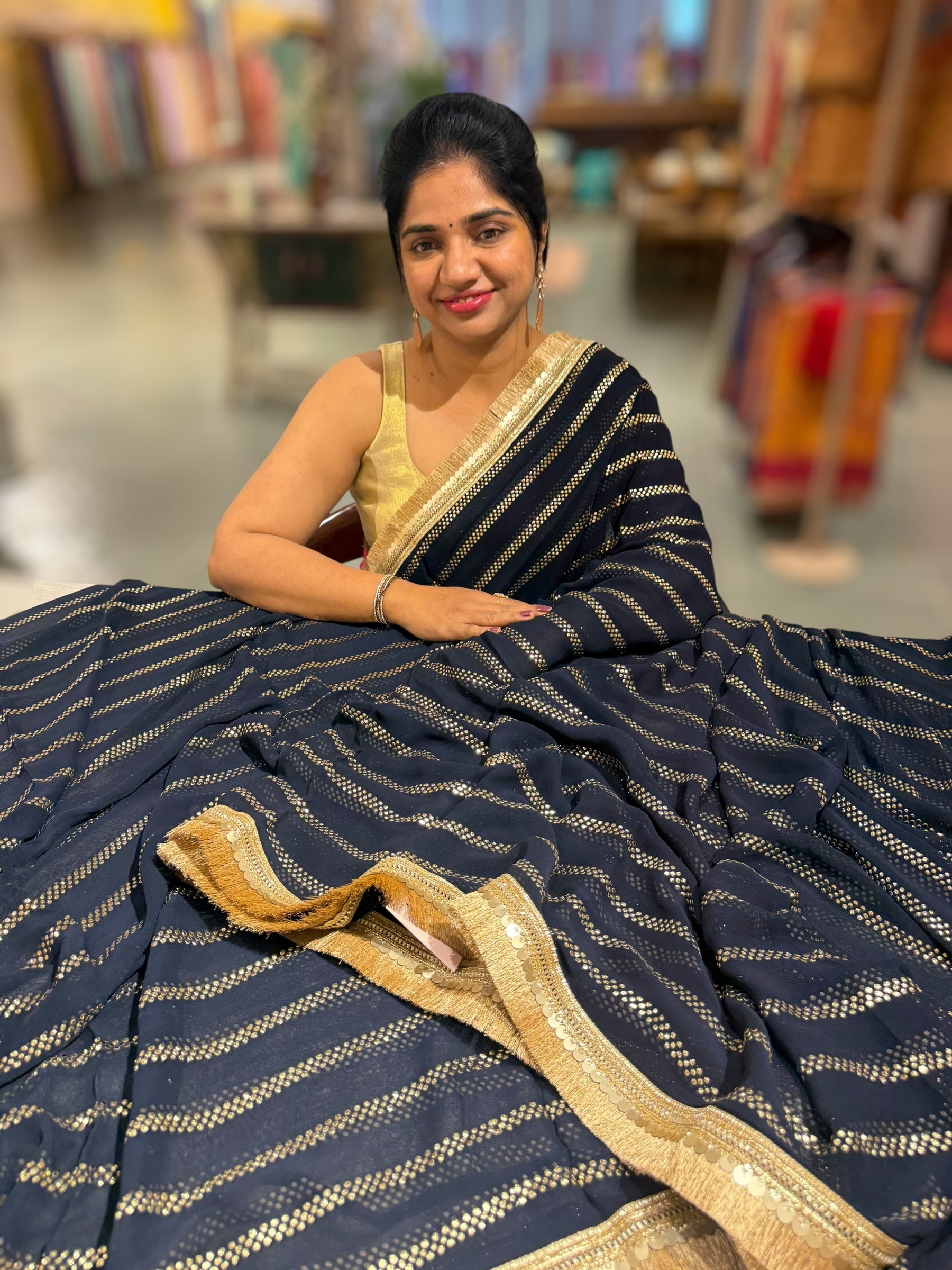 Navy Blue Georgette Saree with stick on Badla in stripes pattern and kiran Lace