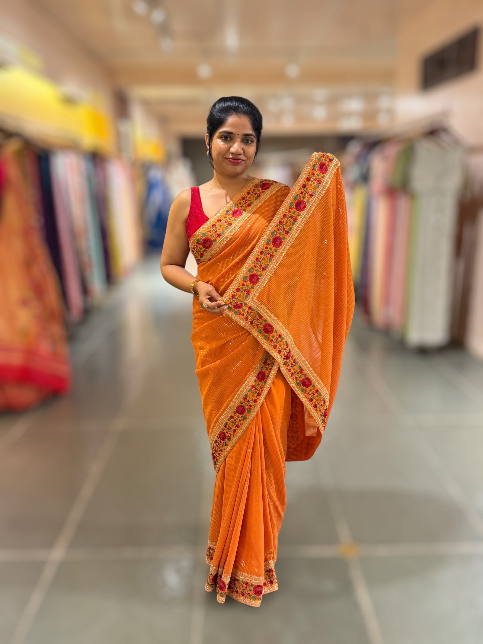 Orange Georgette sequnce Saree with Sabyasachi borders