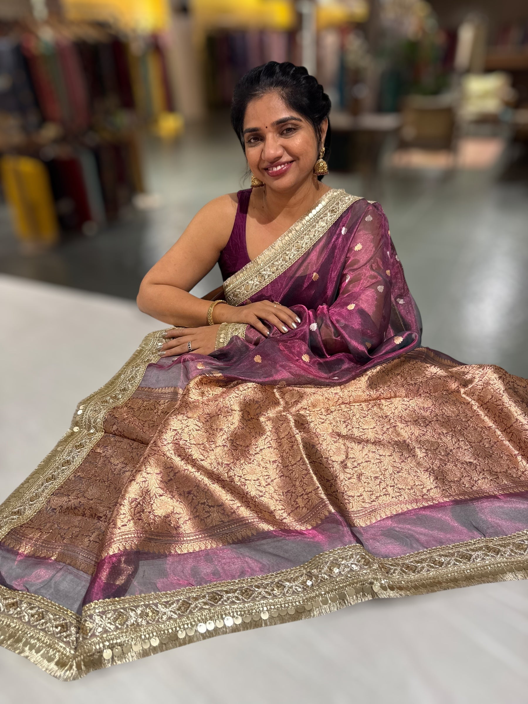 Wine Pure handloom Banarasi Tissue saree hemlined with Sabhyasachi style fringe laces .