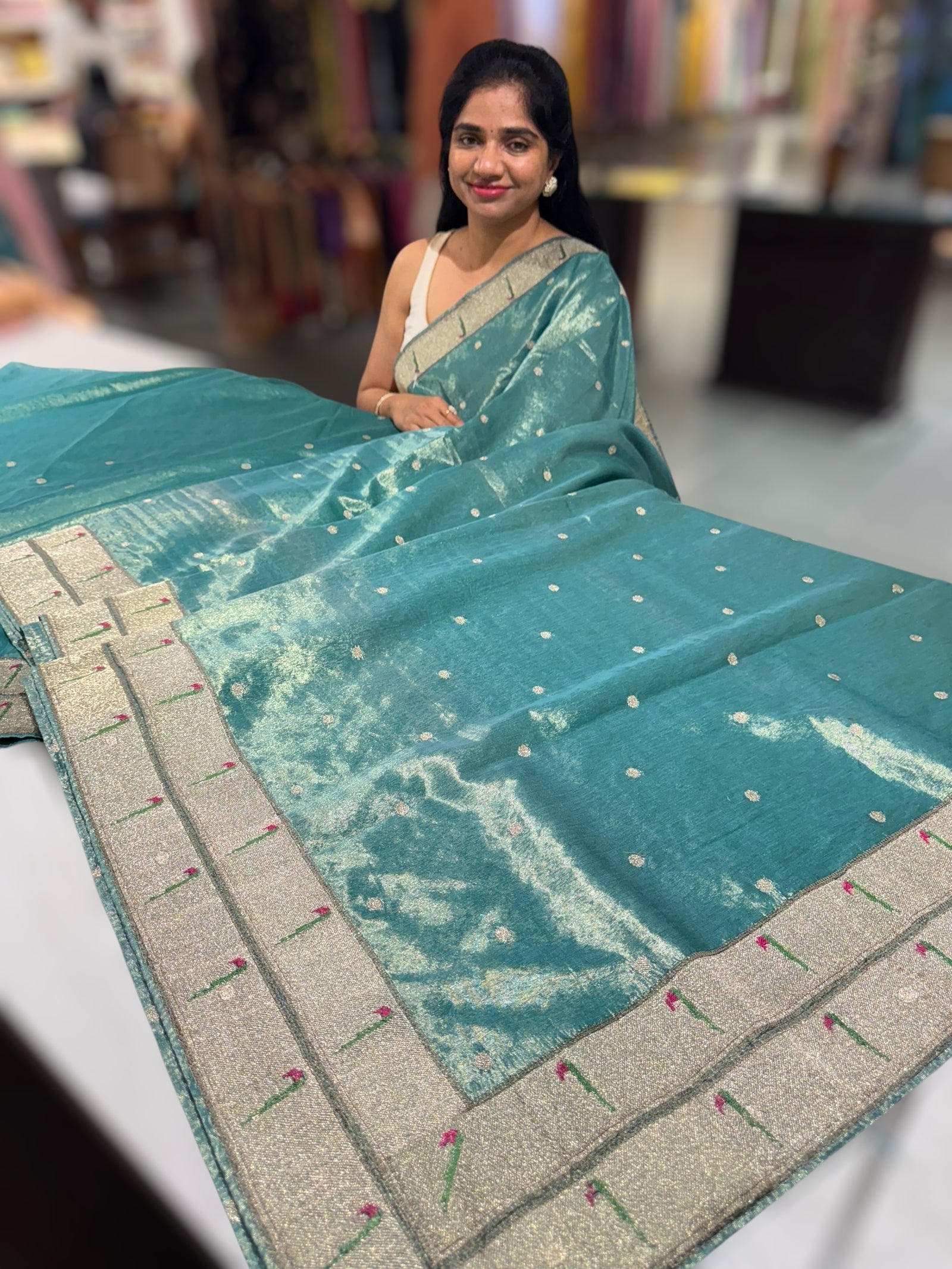 Teal Tissue Saree with pythani inspired muniya borders