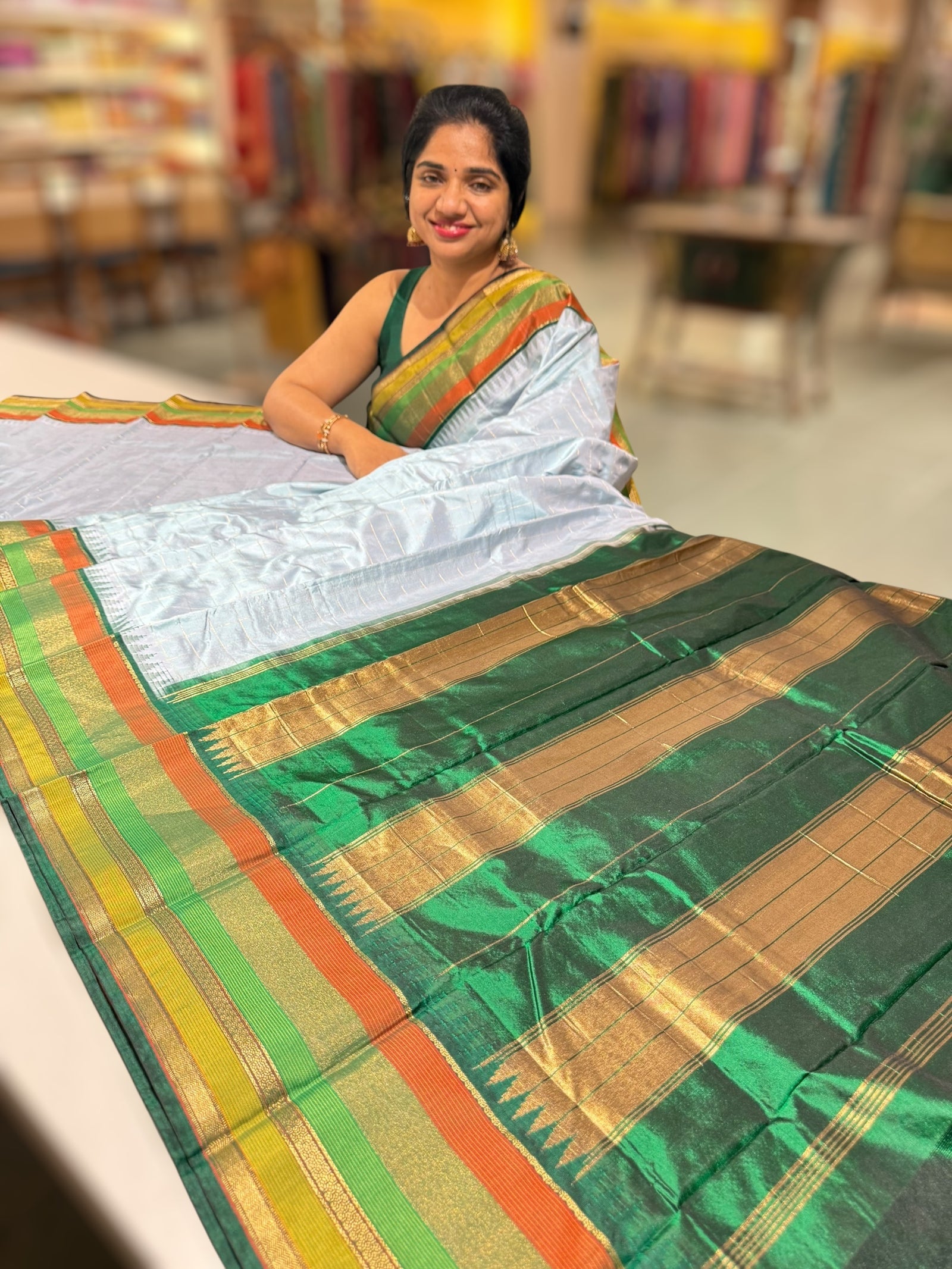Pastel Blue Kanchi vintage style soft silk saree with zari checks & multi color border.
