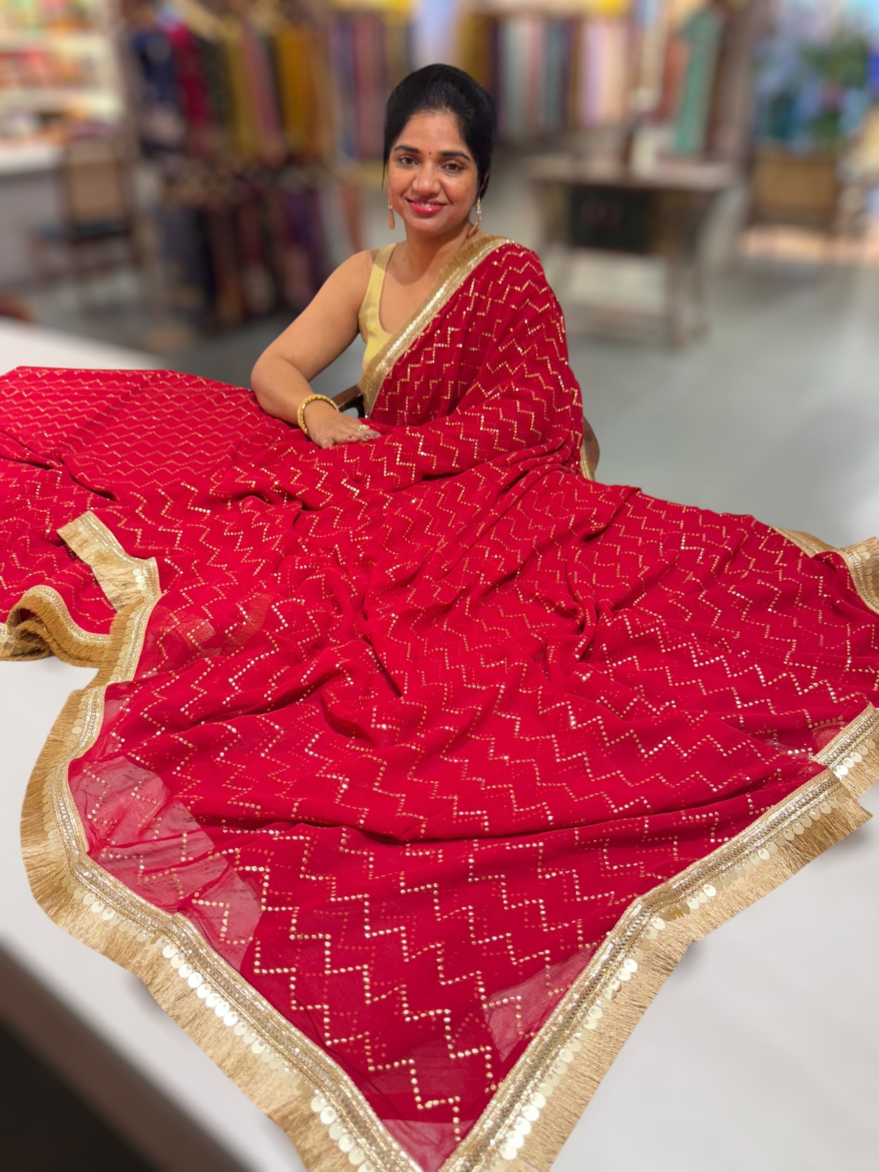 Dark Red Georgette Saree with stick on Badla in zigzag pattern