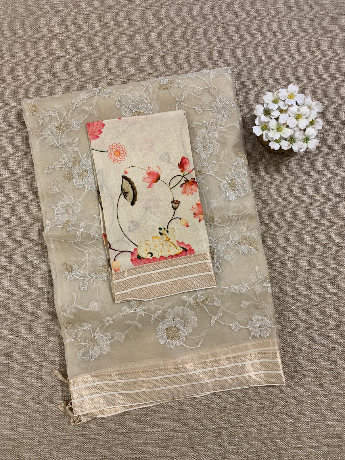 Beige Muslin allover embroidered Saree with pichwai printed blosue