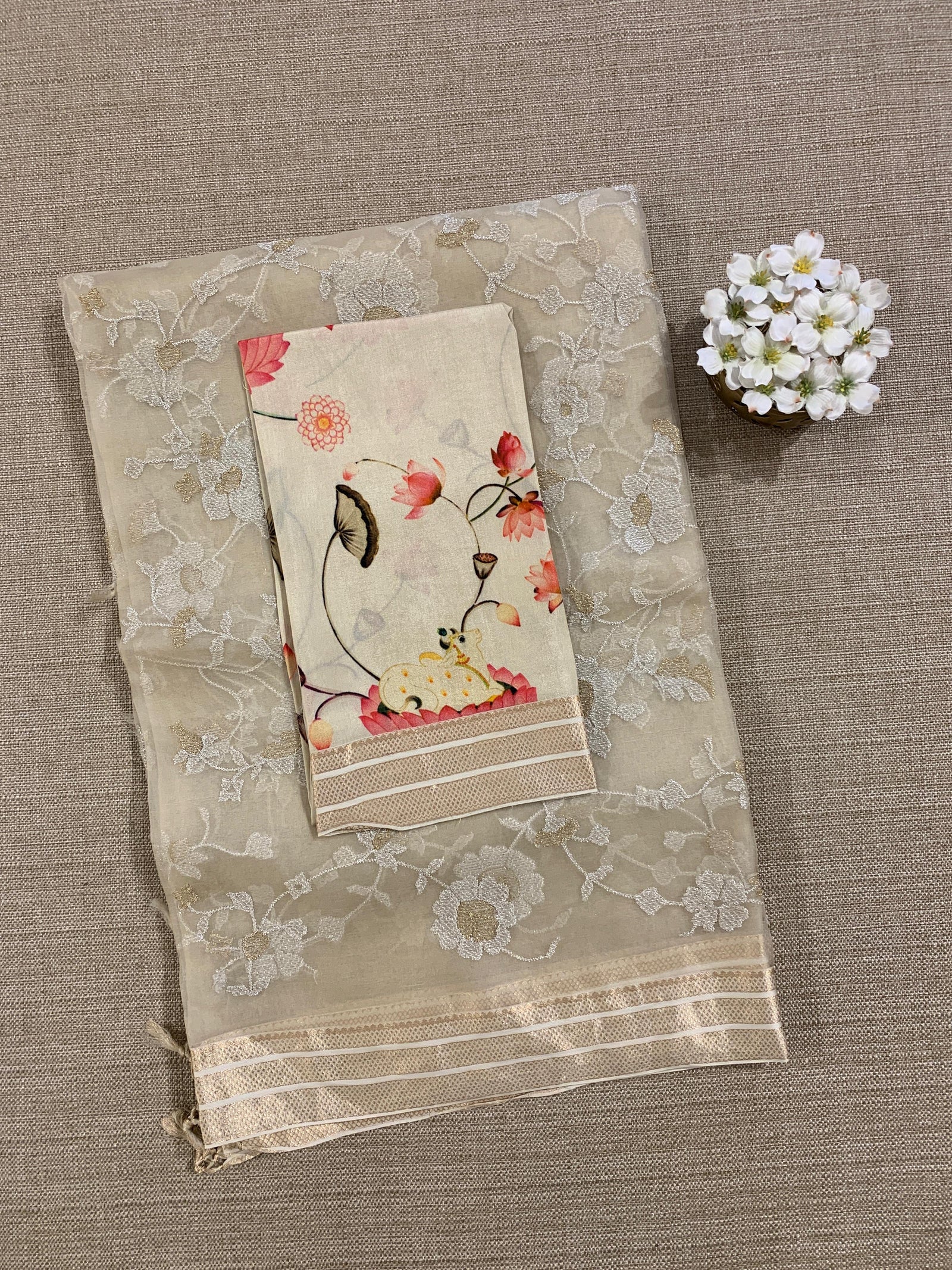 Beige Muslin allover embroidered Saree with pichwai printed blosue