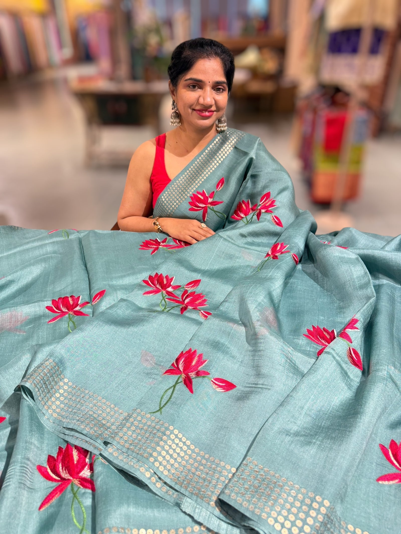 Teal pure handloom tussar byloom saree with lotus embroidered bunch motifs