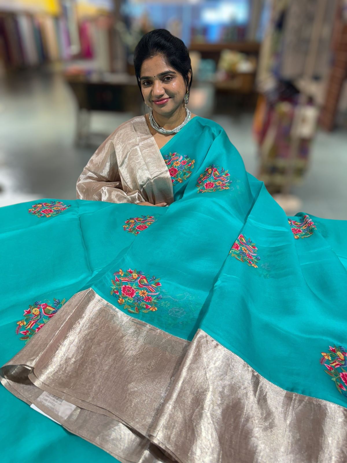 Teal Organza Saree with pure Tissue Border