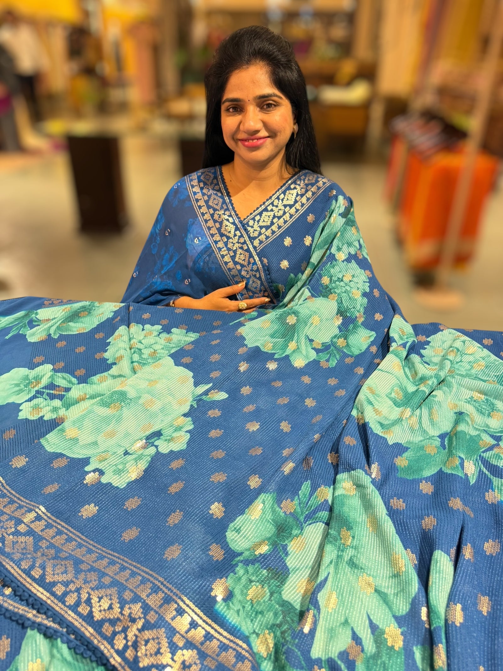 Blue georgette sequence saree with statement floral print