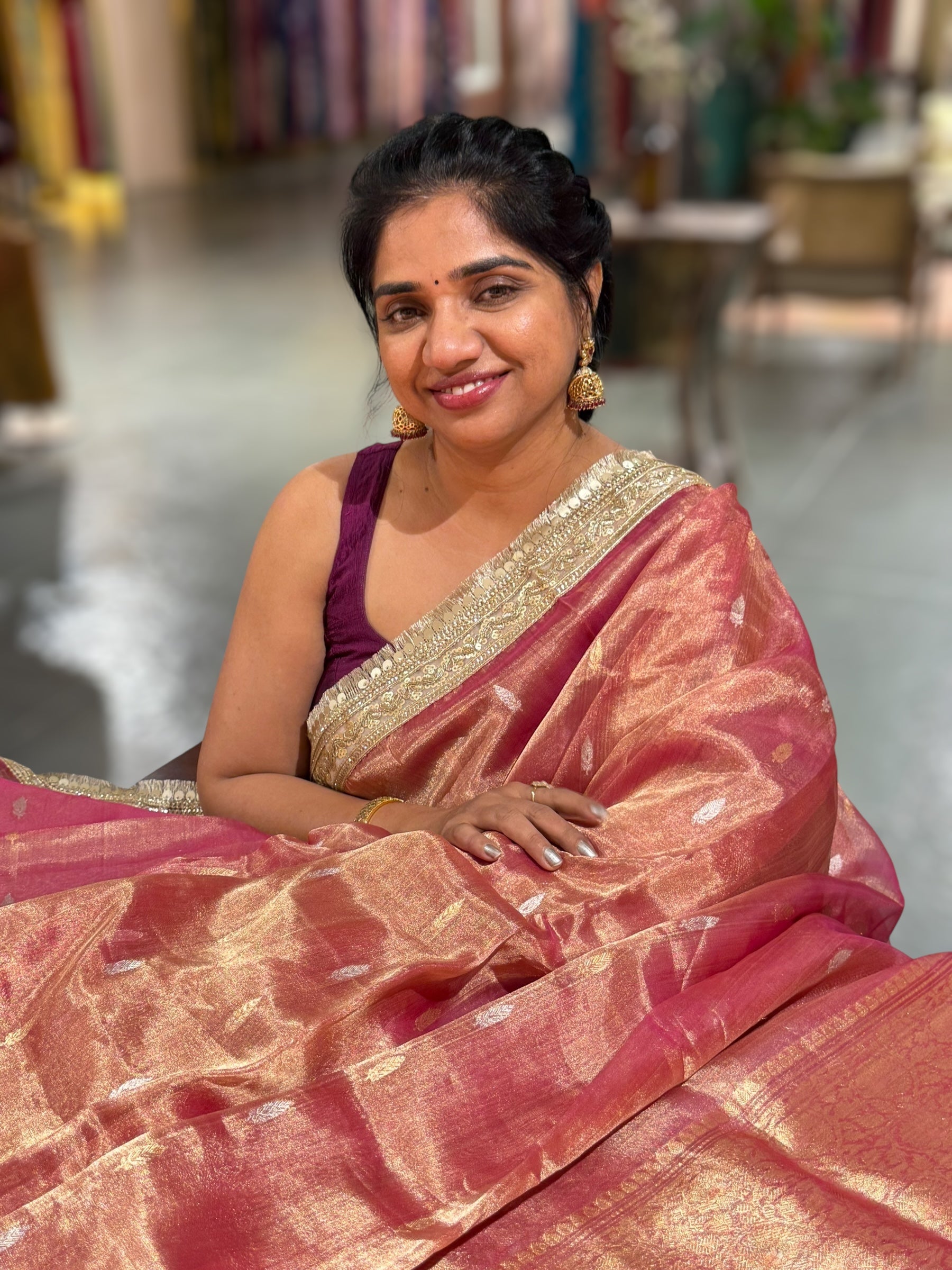 Pink Pure handloom Banarasi Tissue saree hemlined with Sabhyasachi style fringe laces .