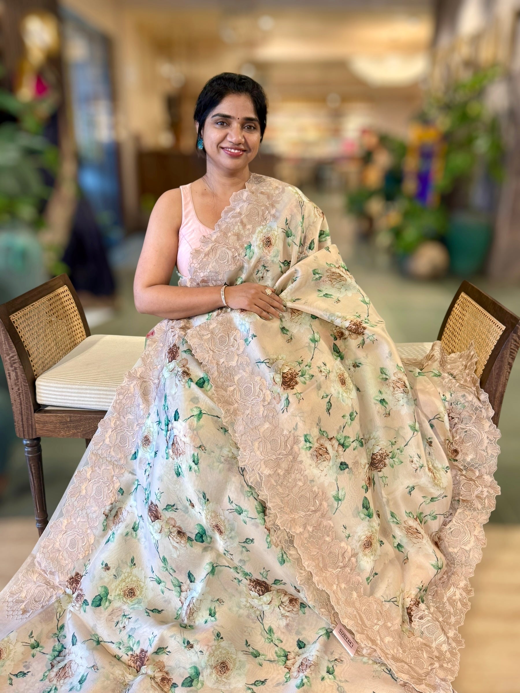 Nude Printed Organza Saree With Chantilly Lace Style Embroidered Border.