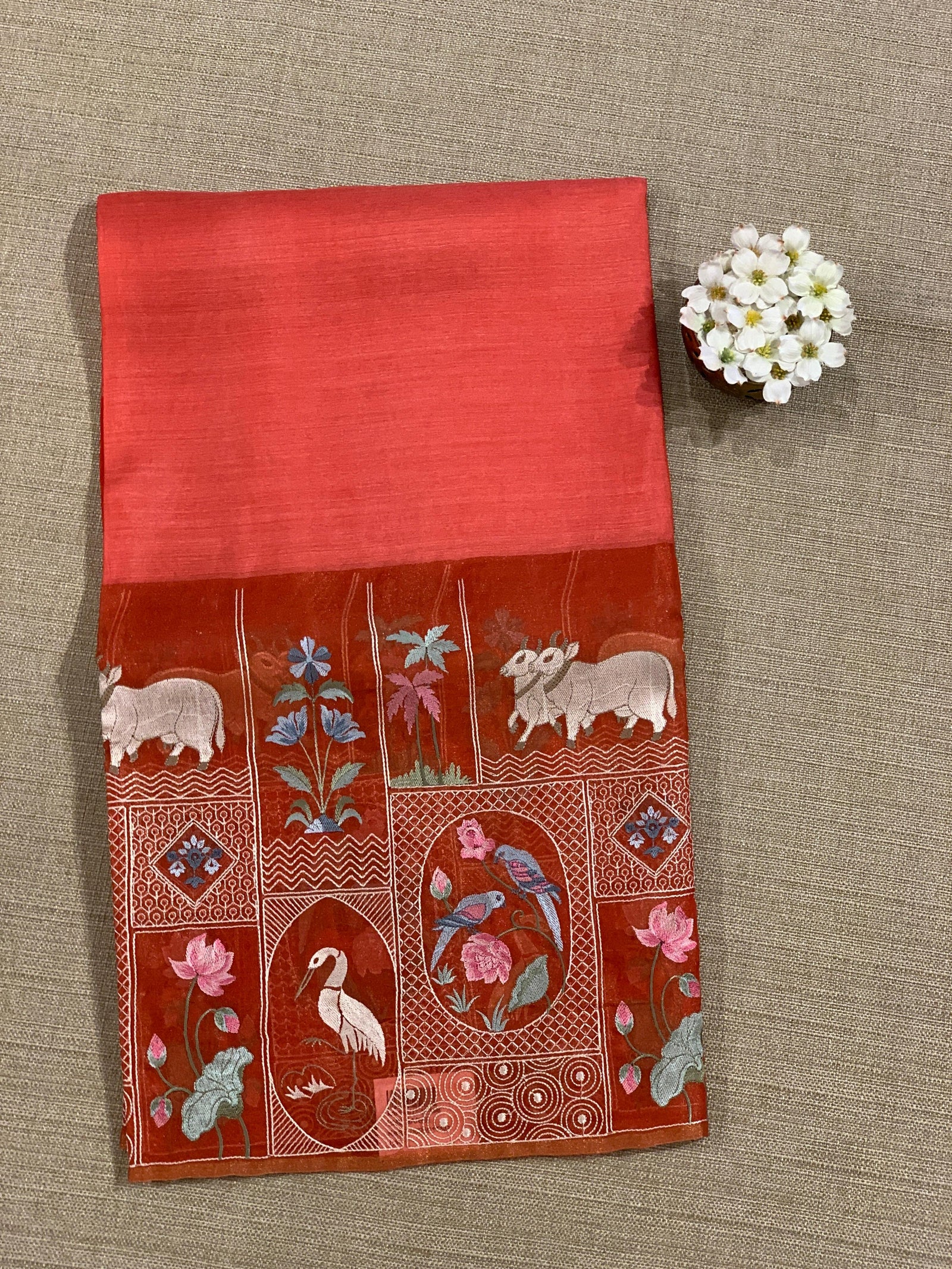Reddish Orange Kora-Tussar blend Handloom Saree with Tissue embroidered Skirt Border