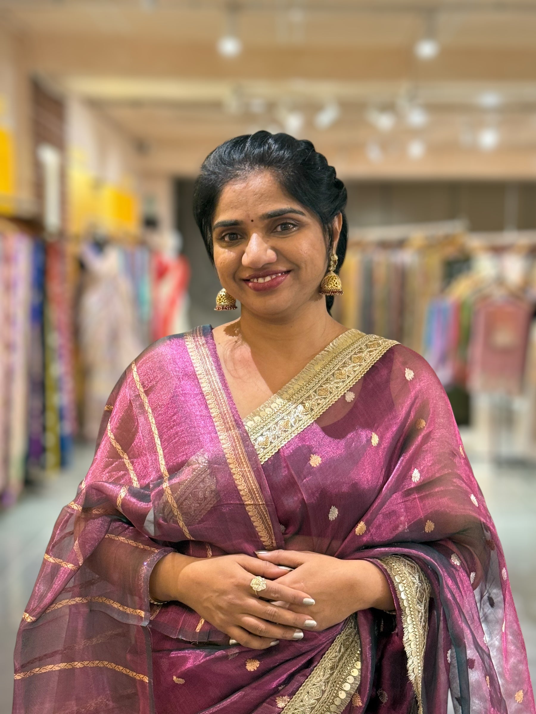 Wine Pure handloom Banarasi Tissue saree hemlined with Sabhyasachi style fringe laces .
