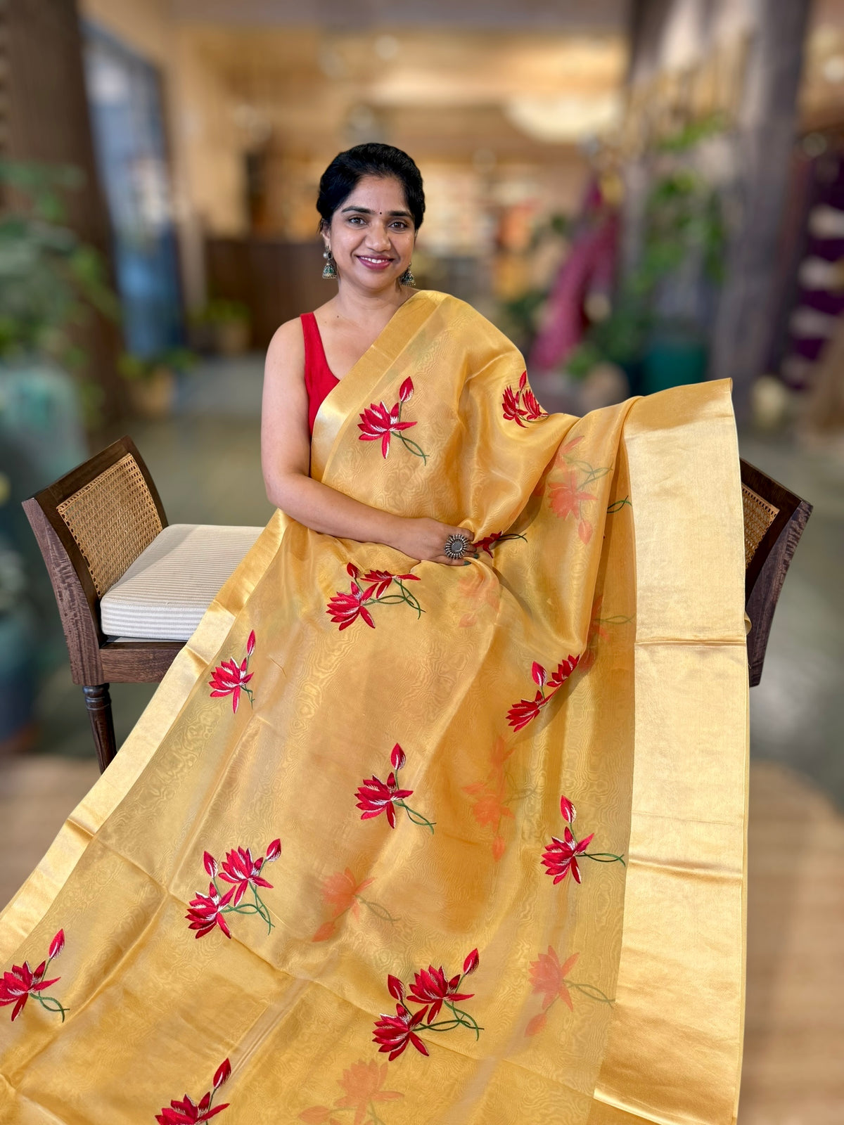 Mustard Organza Saree with Lotus flower embroidery and Satin Borders.